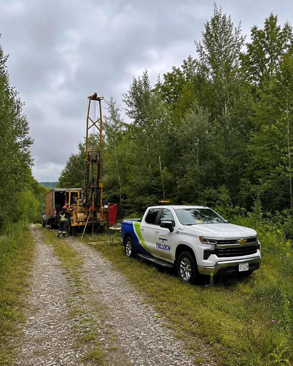 Geotechnical drill rig and TULLOCH vehicle along the North Shore Link transmission corridor.