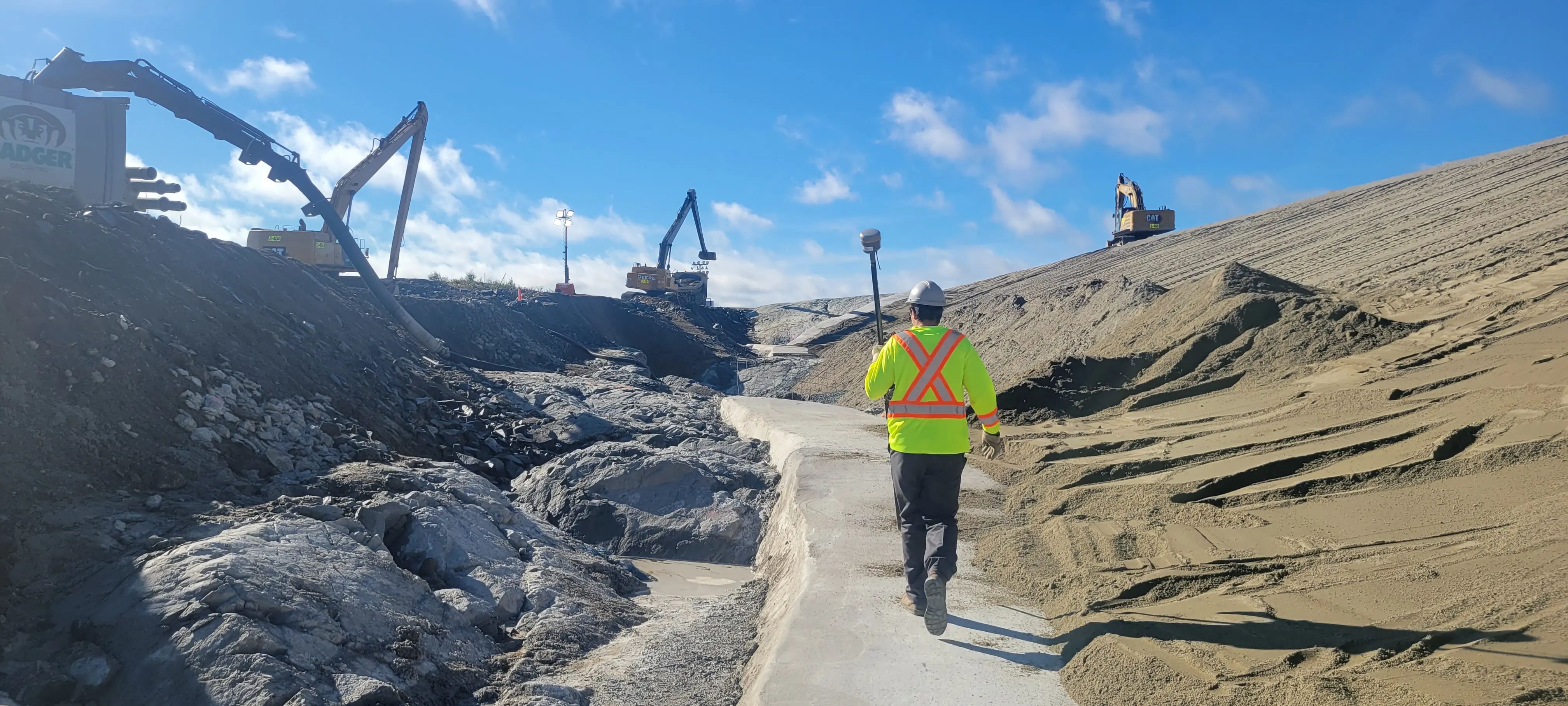 TULLOCH field technician reviewing active earthworks at a tailings management facility.