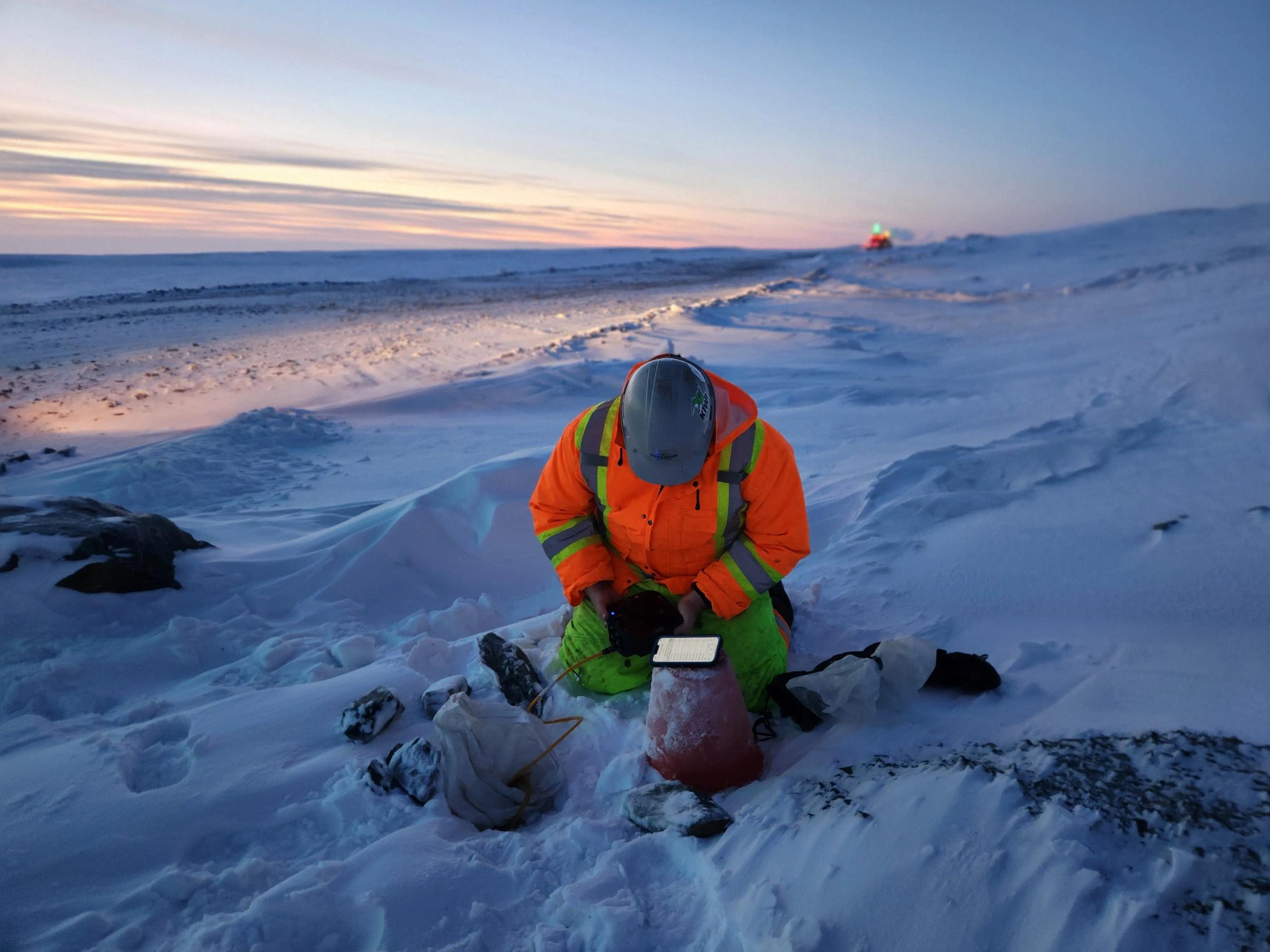 TULLOCH field technician working in snow at a remote mining site in Nunavut.