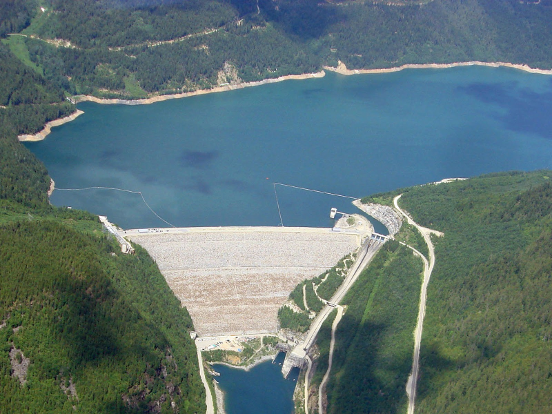 Aerial view of Mica Dam and reservoir infrastructure.