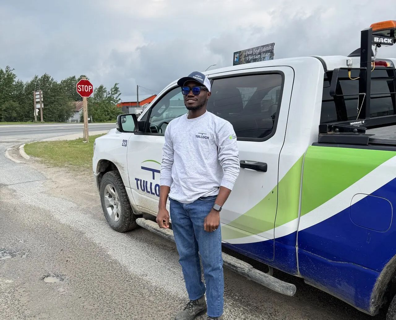 TULLOCH technician in front of truck.