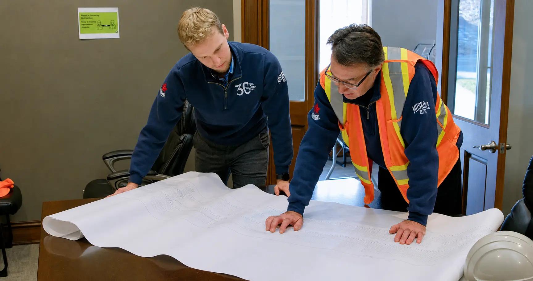 Huntsville engineers reviewing drawings.