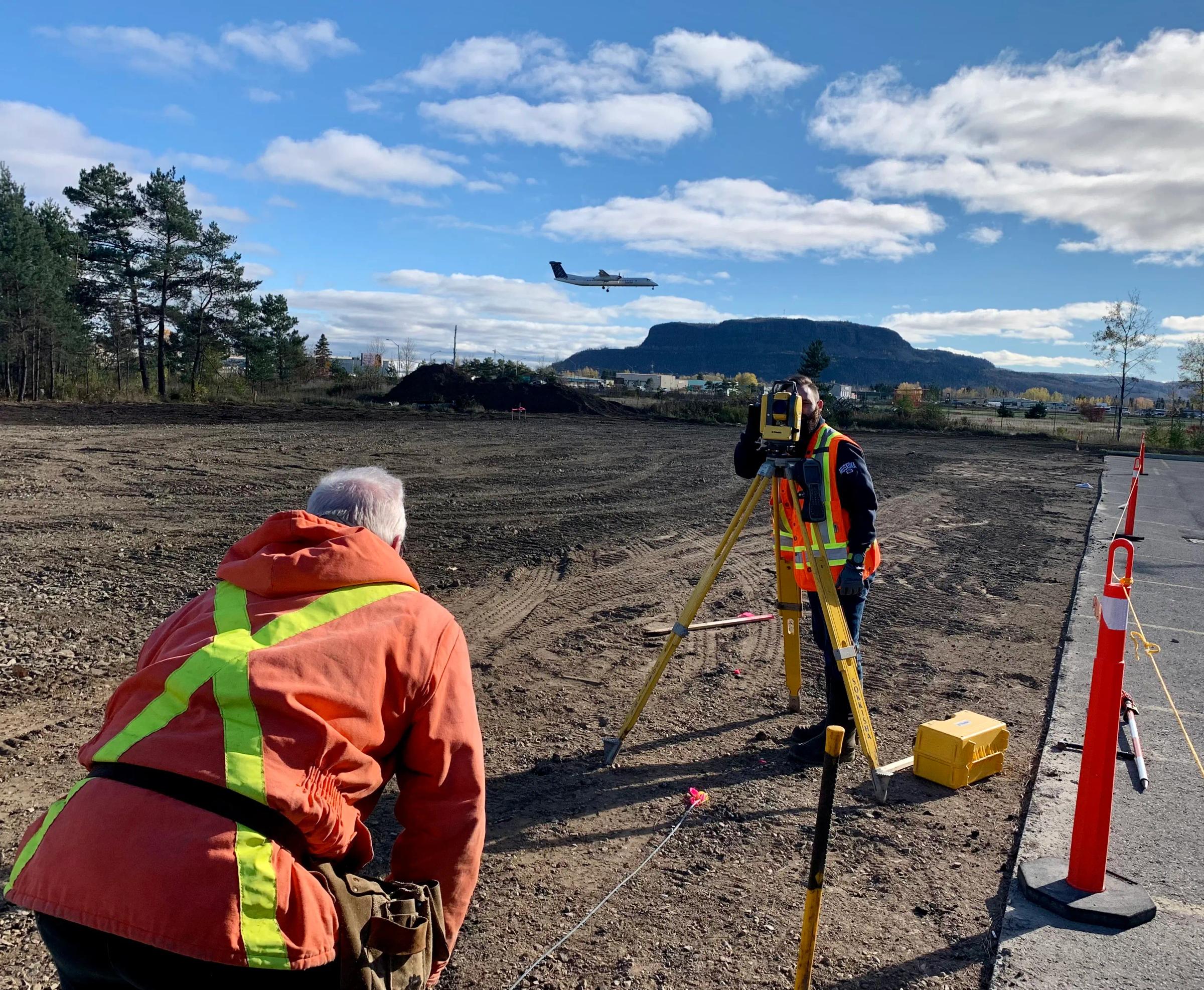 TULLOCH survey crew completing layout work at a construction site.