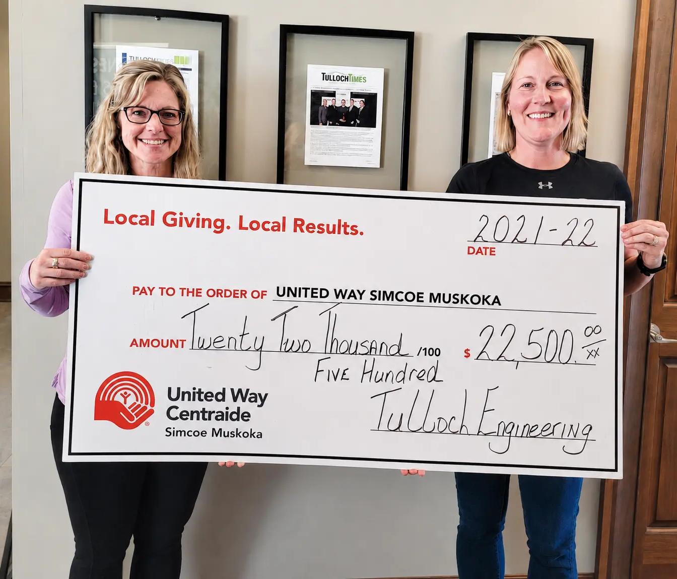 TULLOCH staff with large cheque donation to United Way.