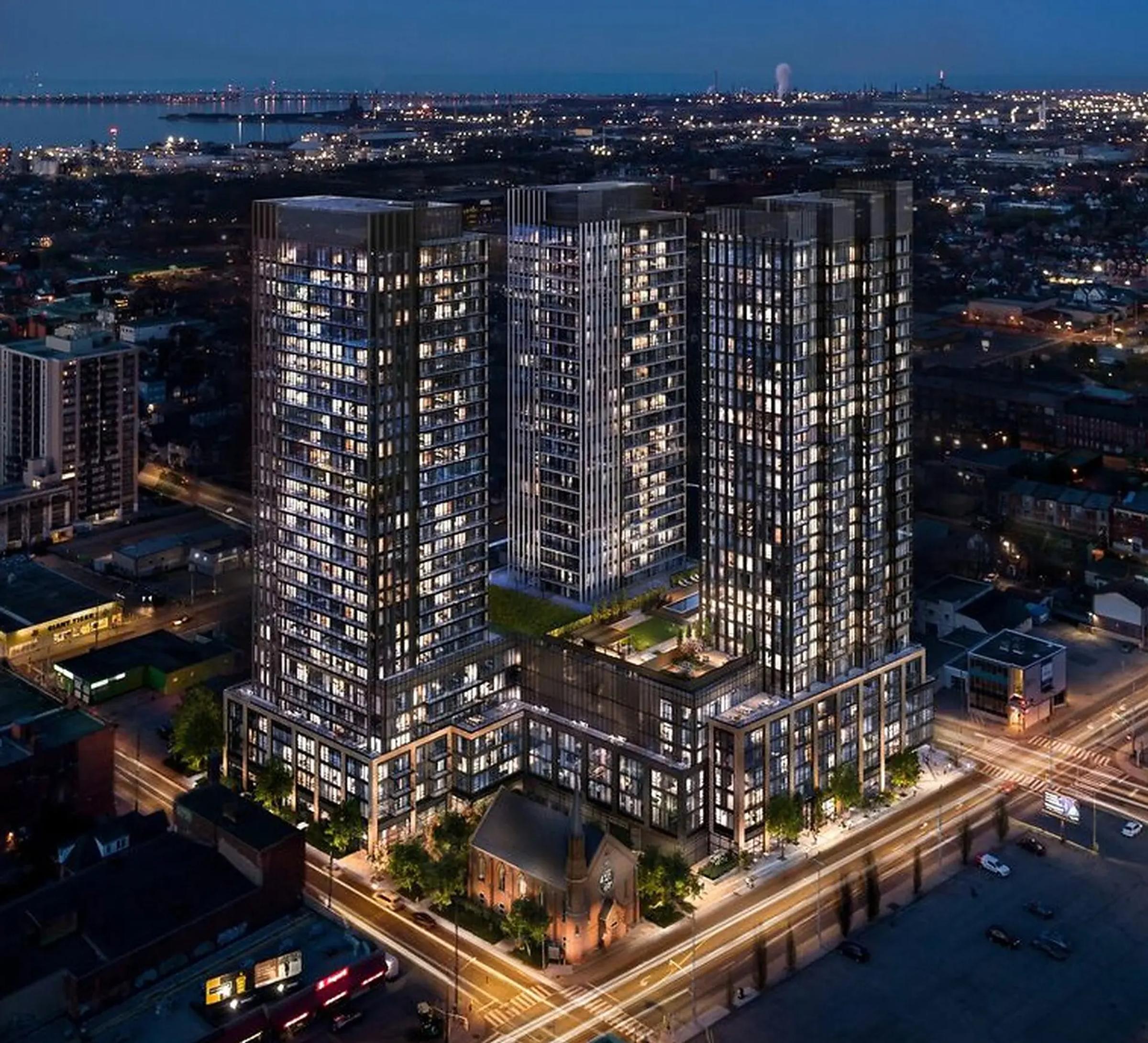 Night aerial rendering of the three-tower Design District 41 development in downtown Hamilton.
