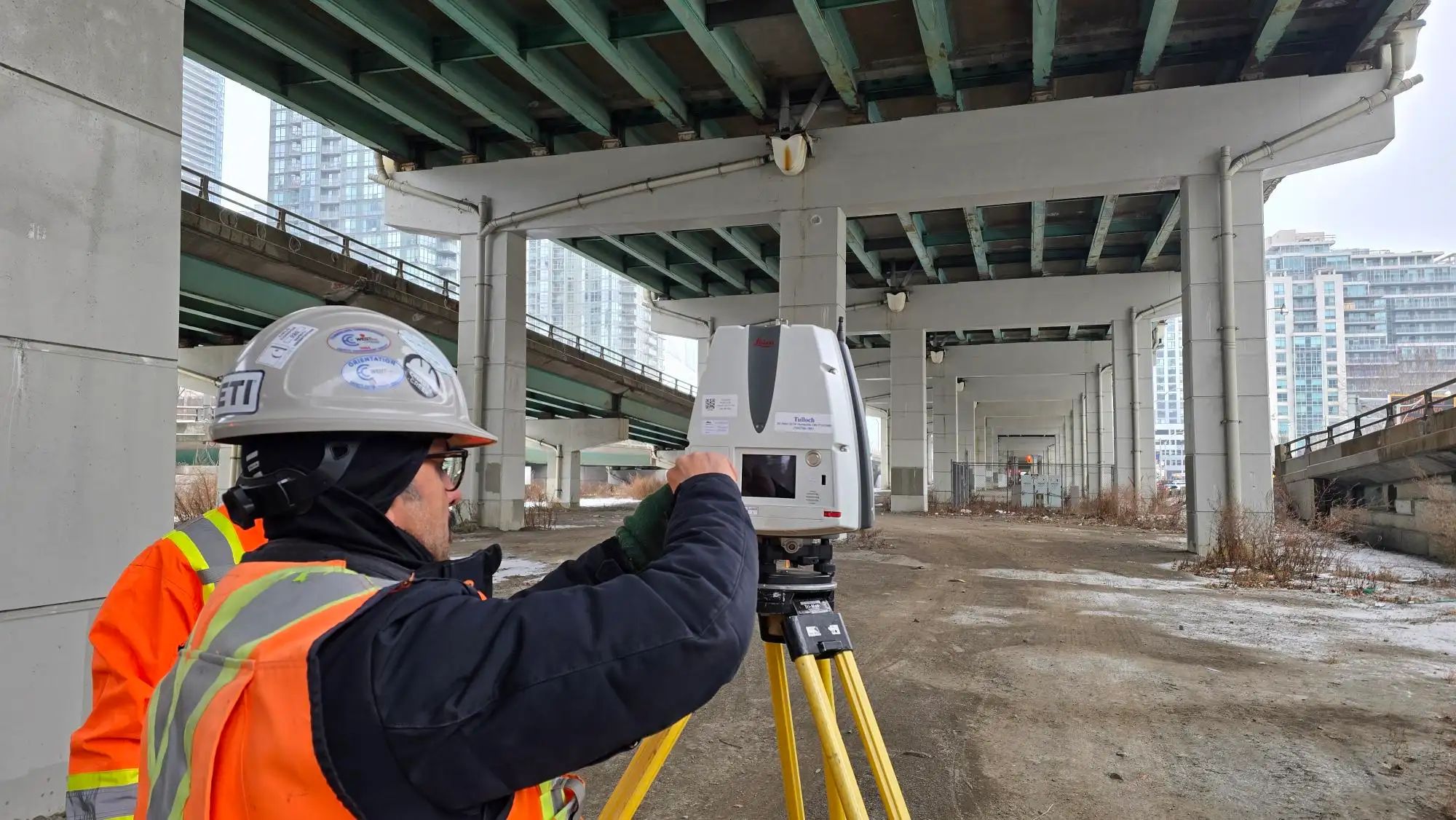 TULLOCH survey technician collecting measurements beneath the Gardiner Expressway.