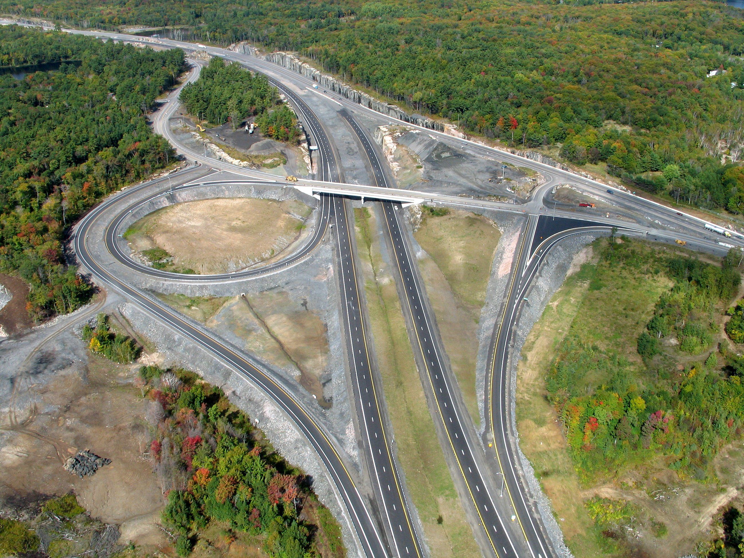 Aerial view of a Highway 69 interchange and surrounding transportation corridor.