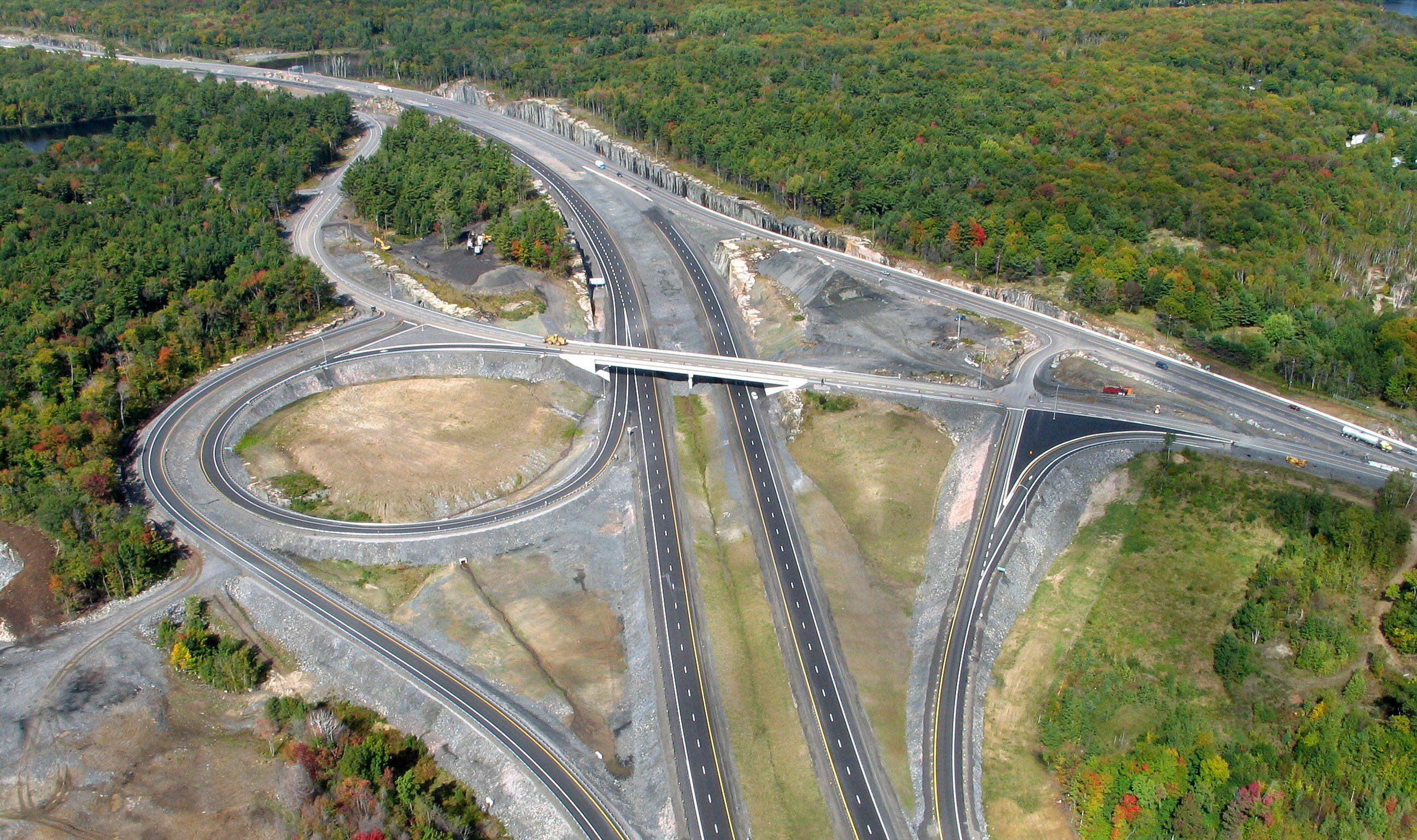 Aerial view of a Highway 69 interchange and surrounding transportation corridor.