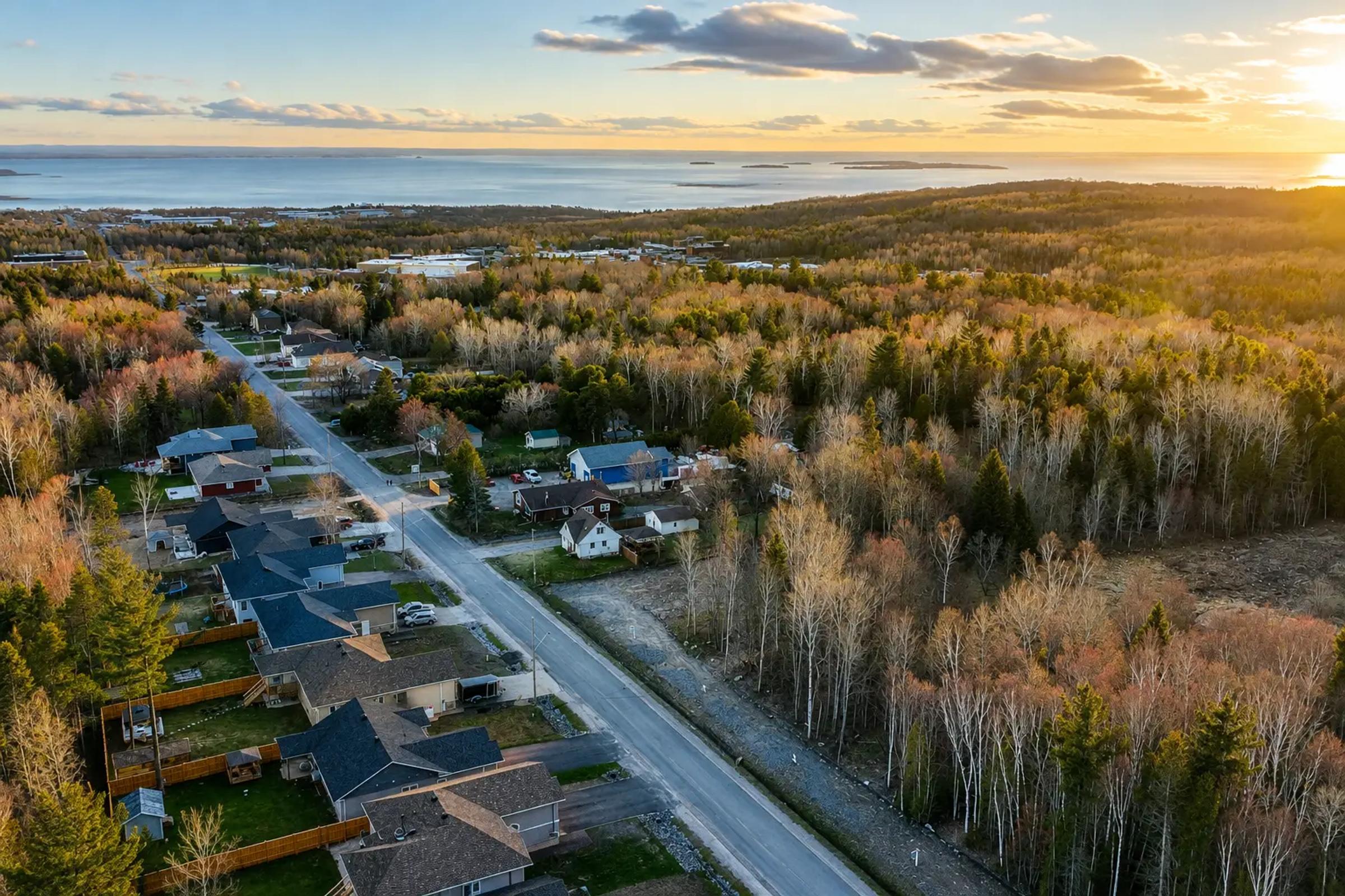Aerial view of the Nipissing Heights residential development at sunset.
