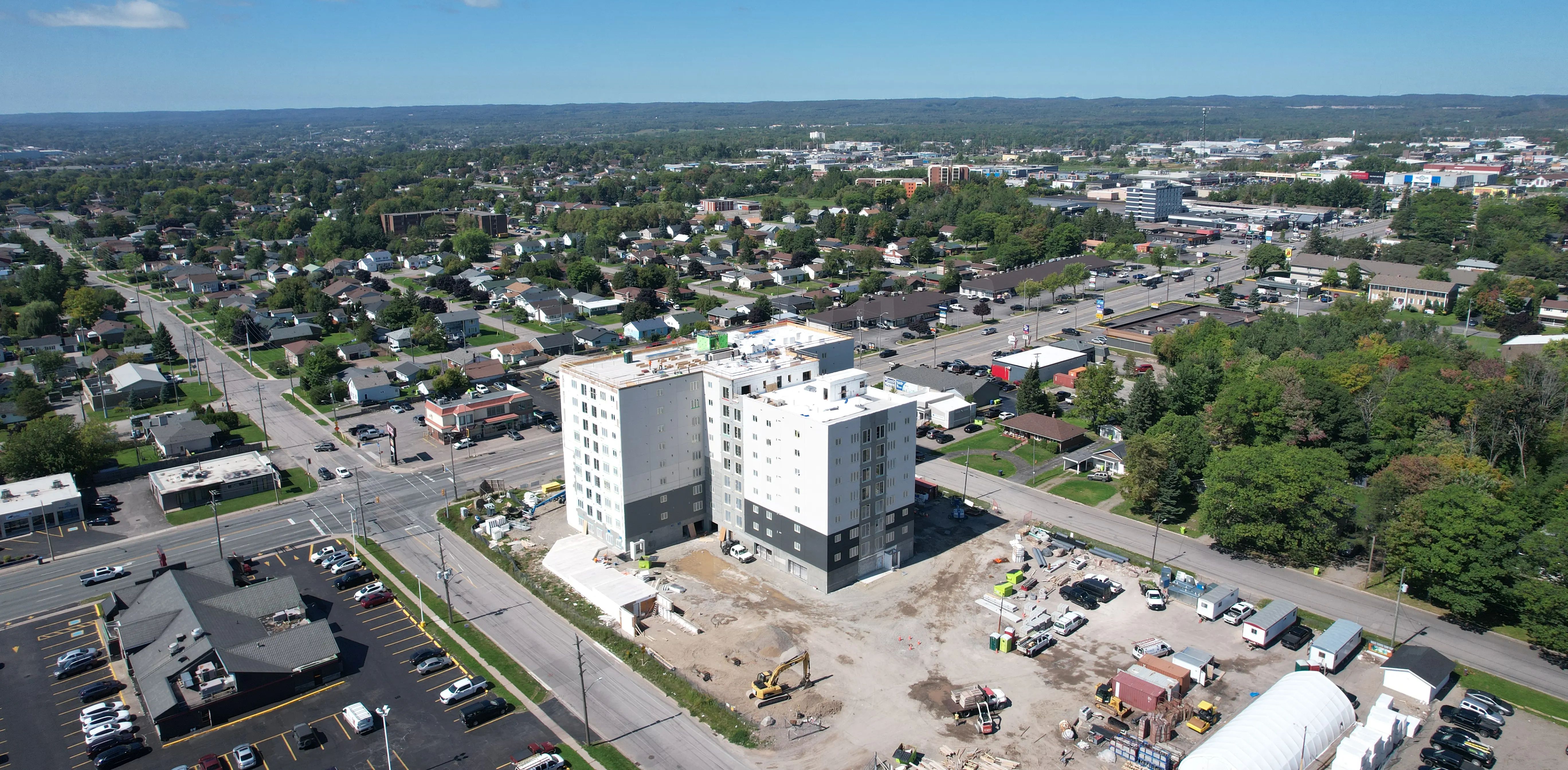 Aerial view of a multi-storey residential development under construction in an urban neighbourhood.