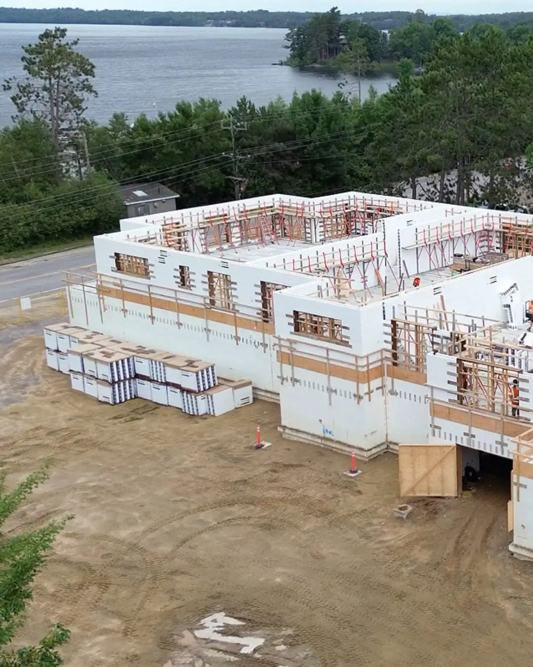 Foundation and concrete walls under construction for a multi-unit building.
