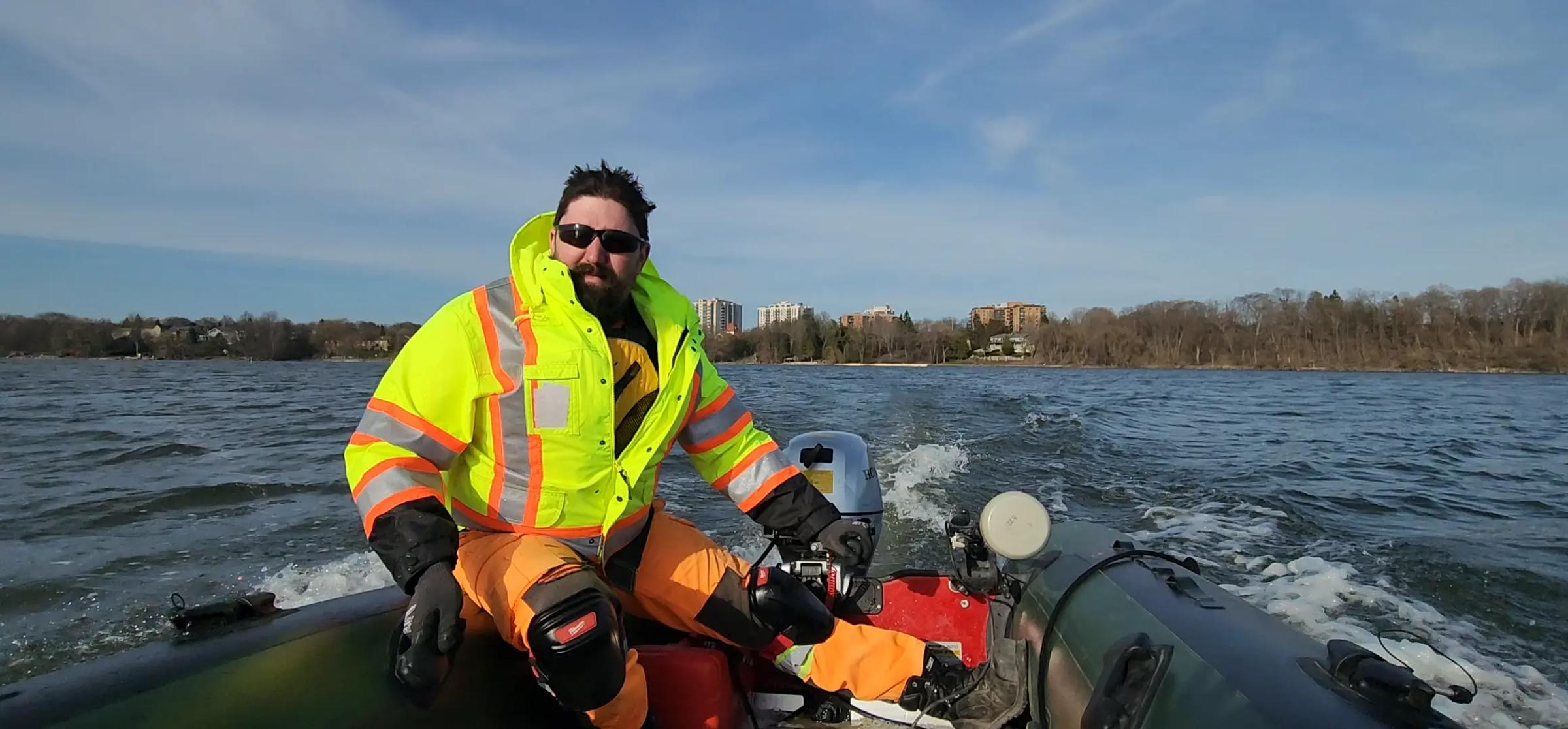 Bathymetric survey by field technician in boat.