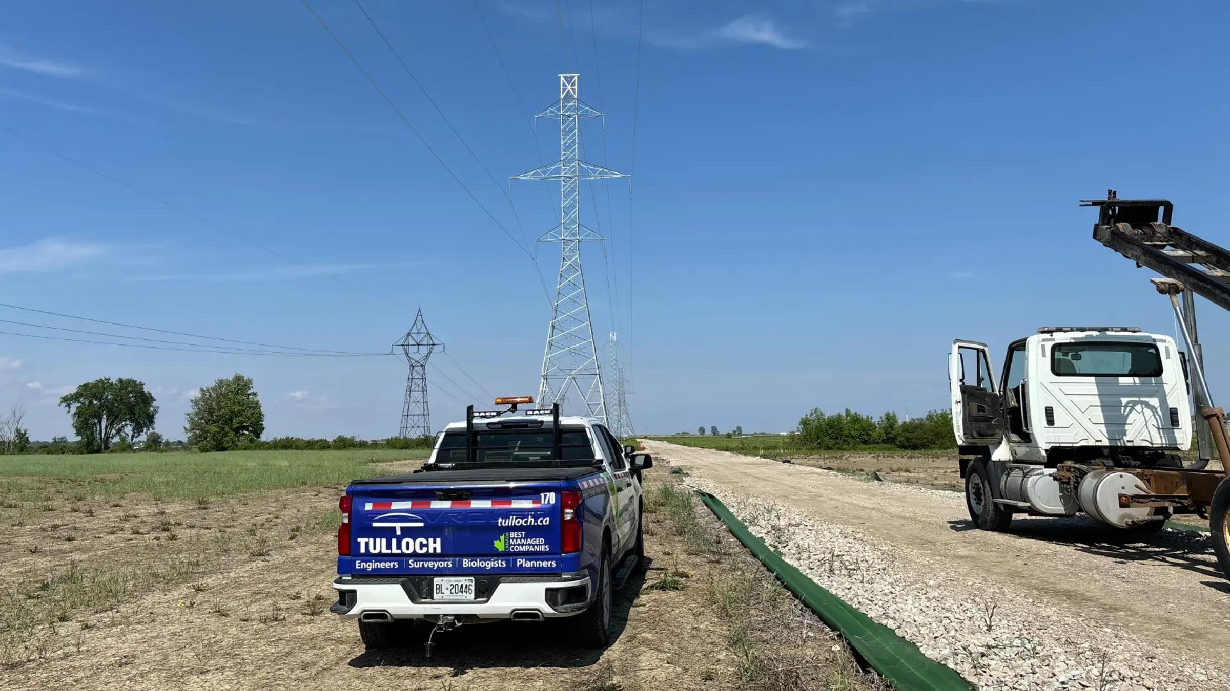 TULLOCH company truck and construction equipment at a battery energy storage project.