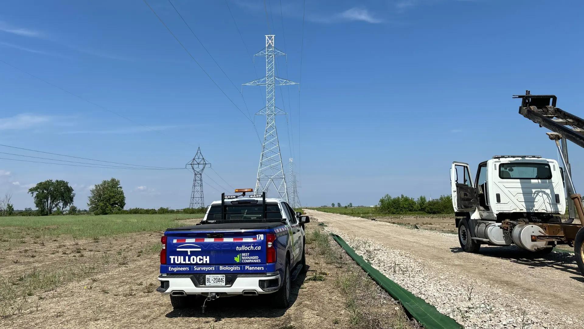 TULLOCH company truck and construction equipment at a battery energy storage project.
