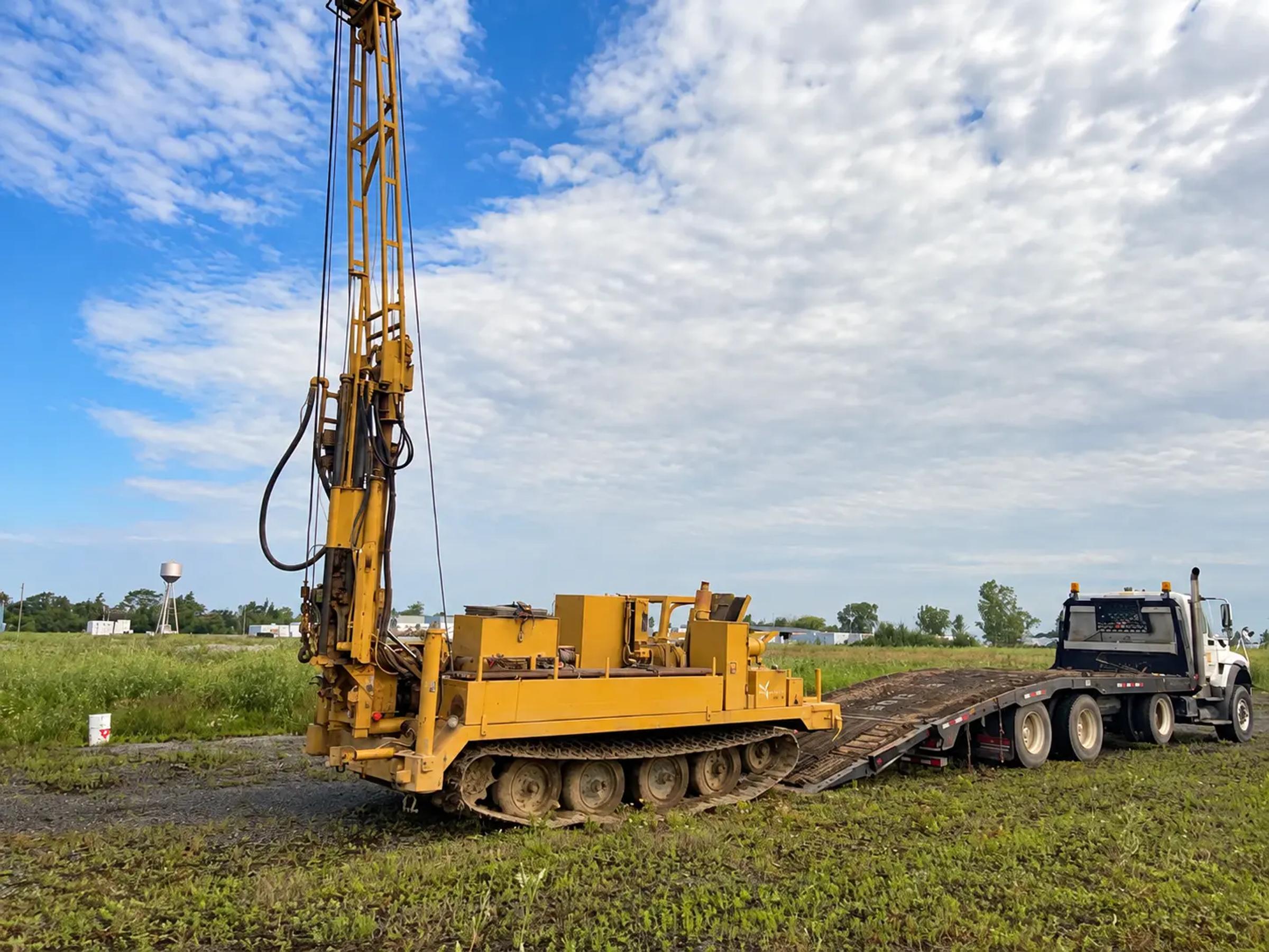 Geotechnical drill rig operating at an Ontario BESS project site.