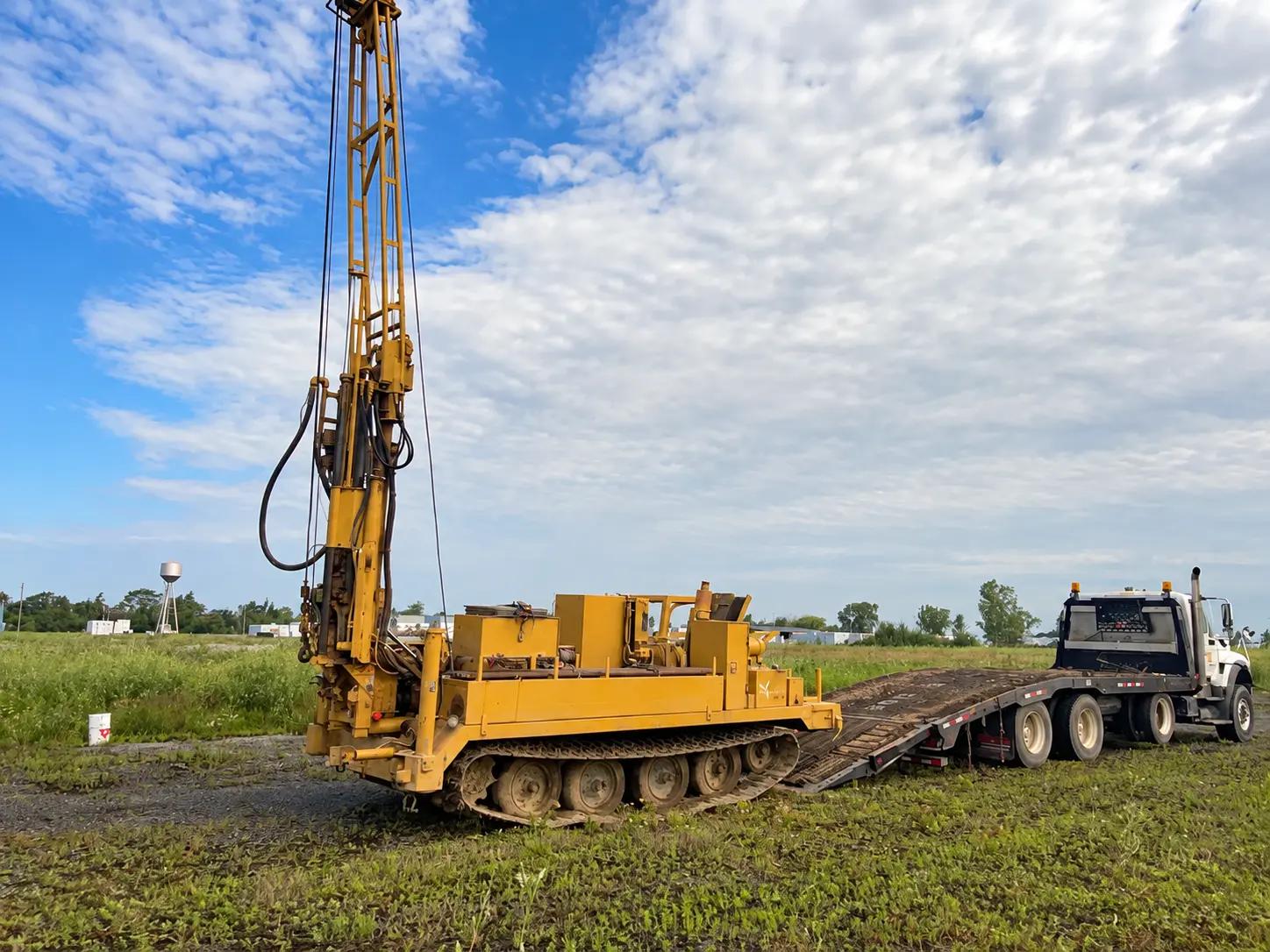 Geotechnical drill rig operating at an Ontario BESS project site.