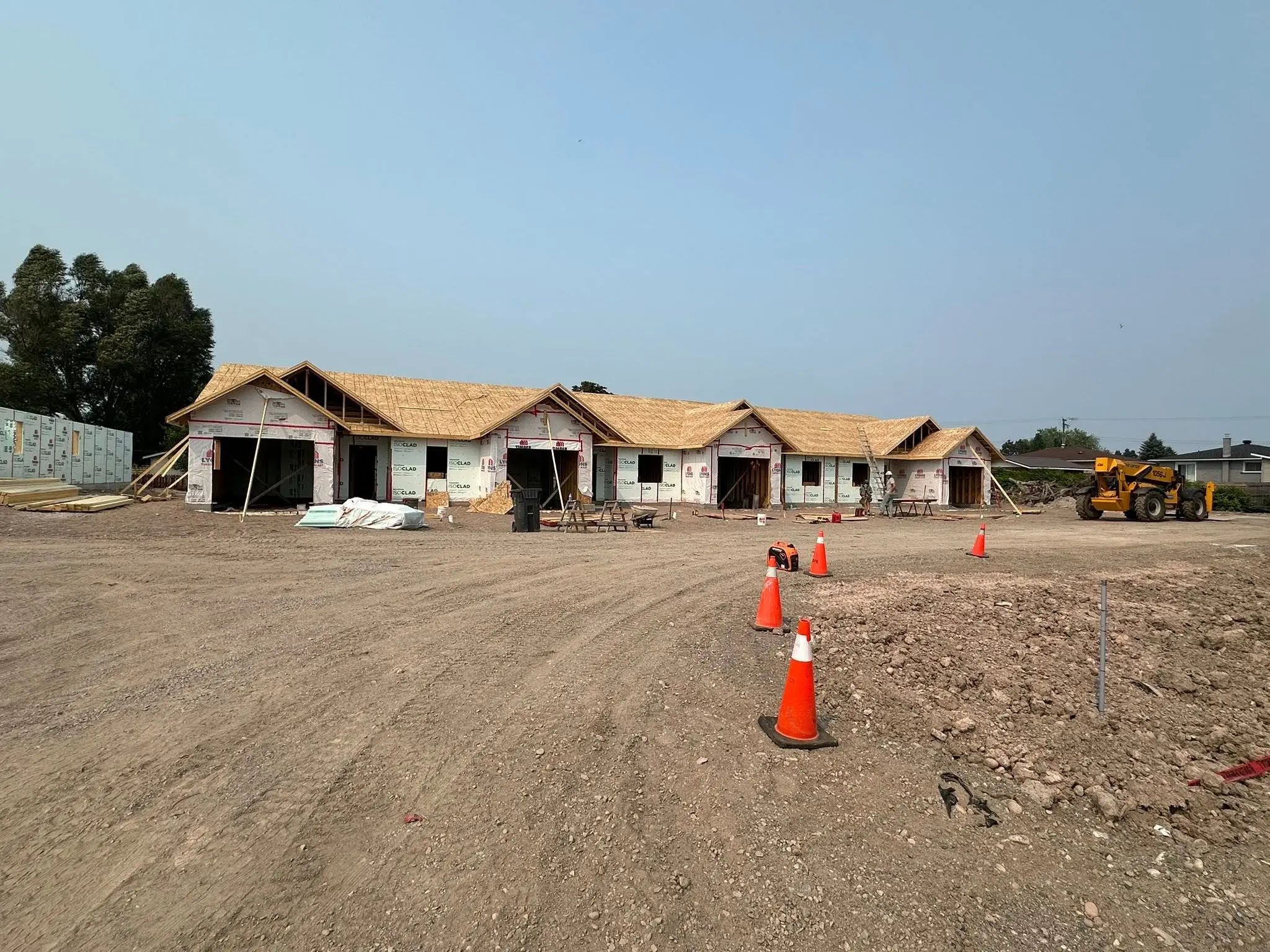 Korah Road project building under construction with site grading in progress.