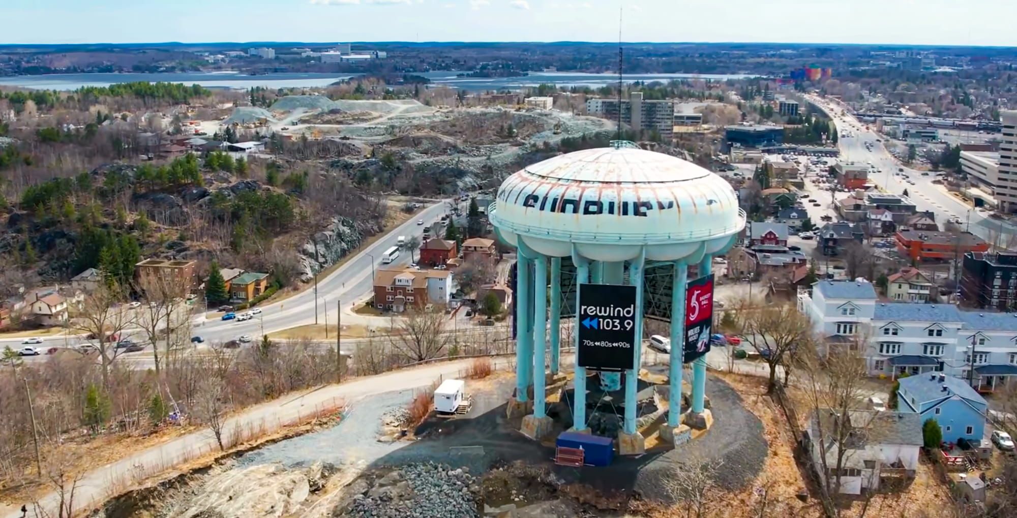 Aerial view of a municipal water tower and surrounding community.