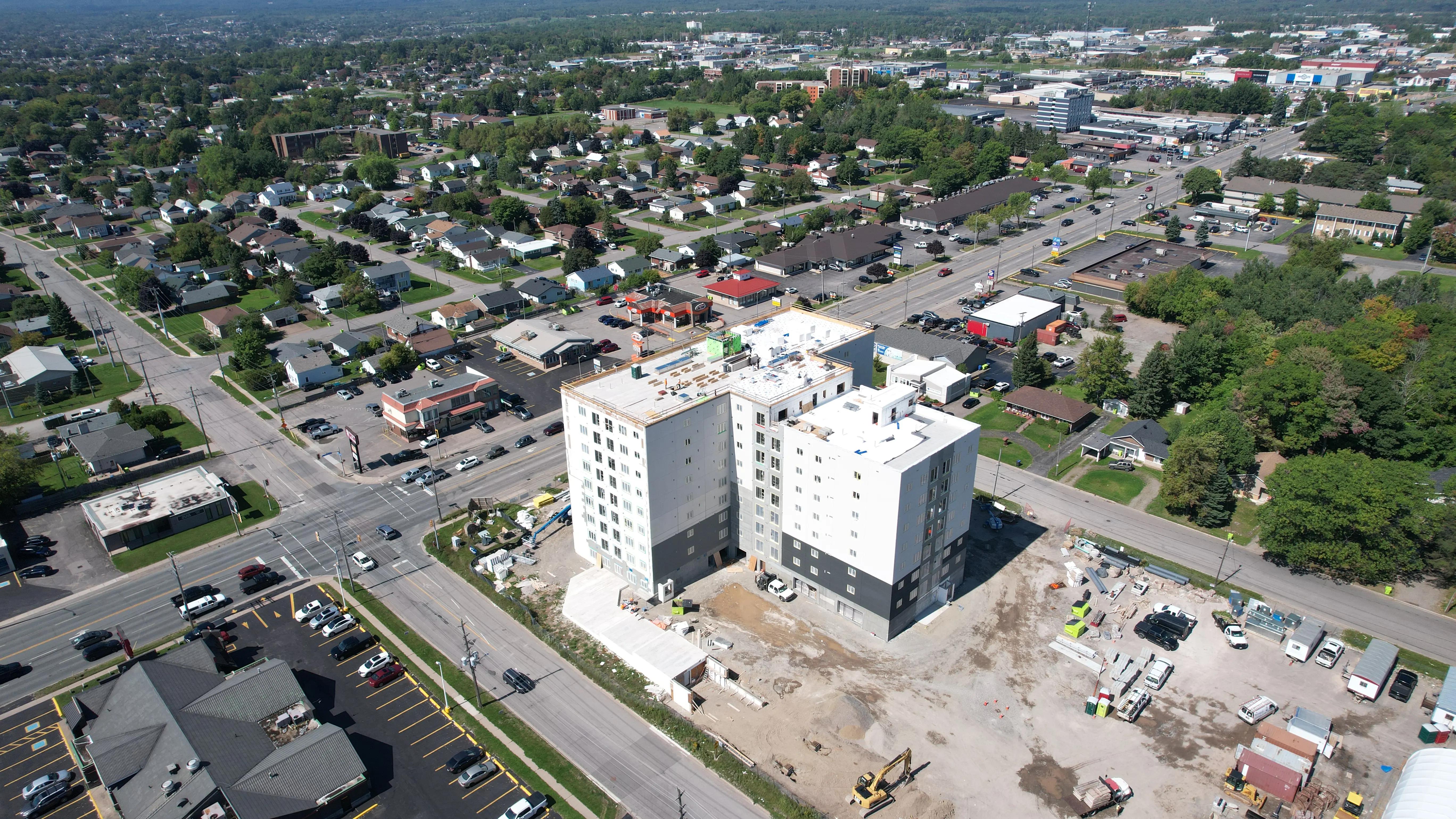 Aerial view of an urban construction project and surrounding neighbourhood.