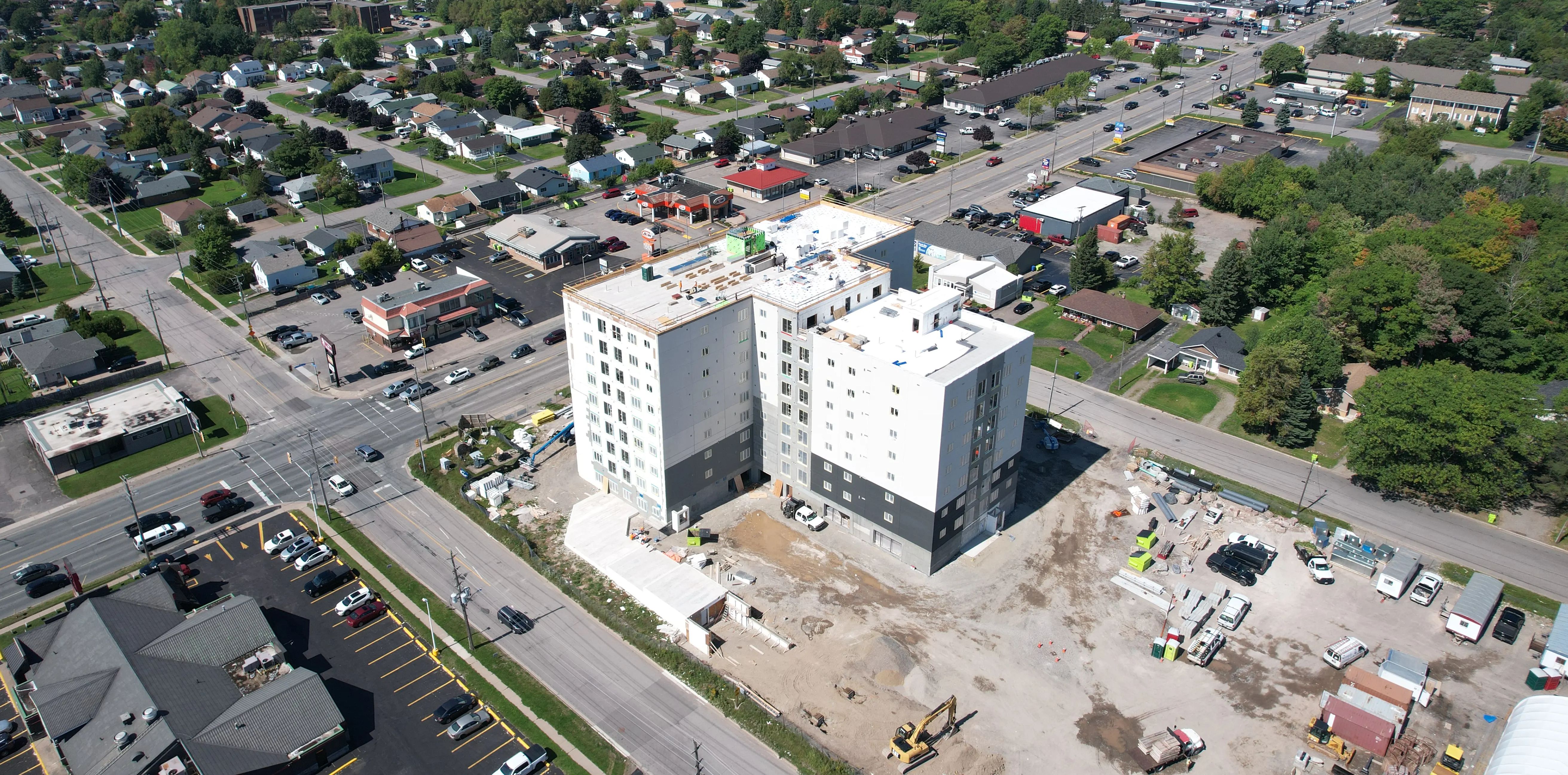 Aerial view of an urban construction project and surrounding neighbourhood.