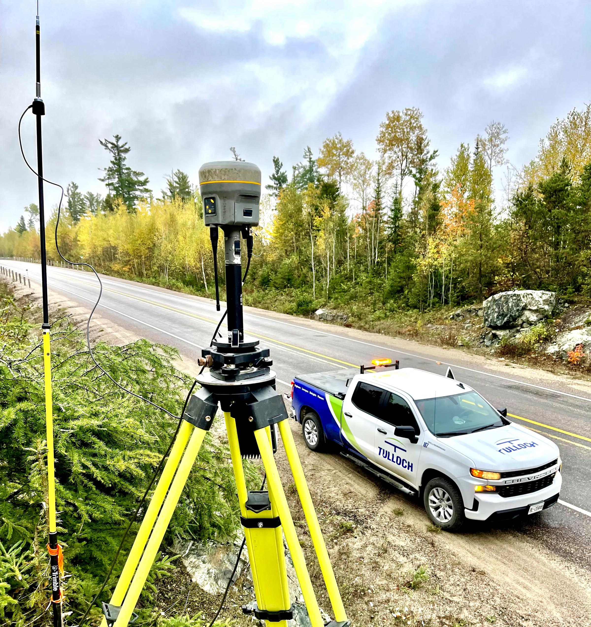 Survey equipment beside Highway 3 with a TULLOCH vehicle nearby.
