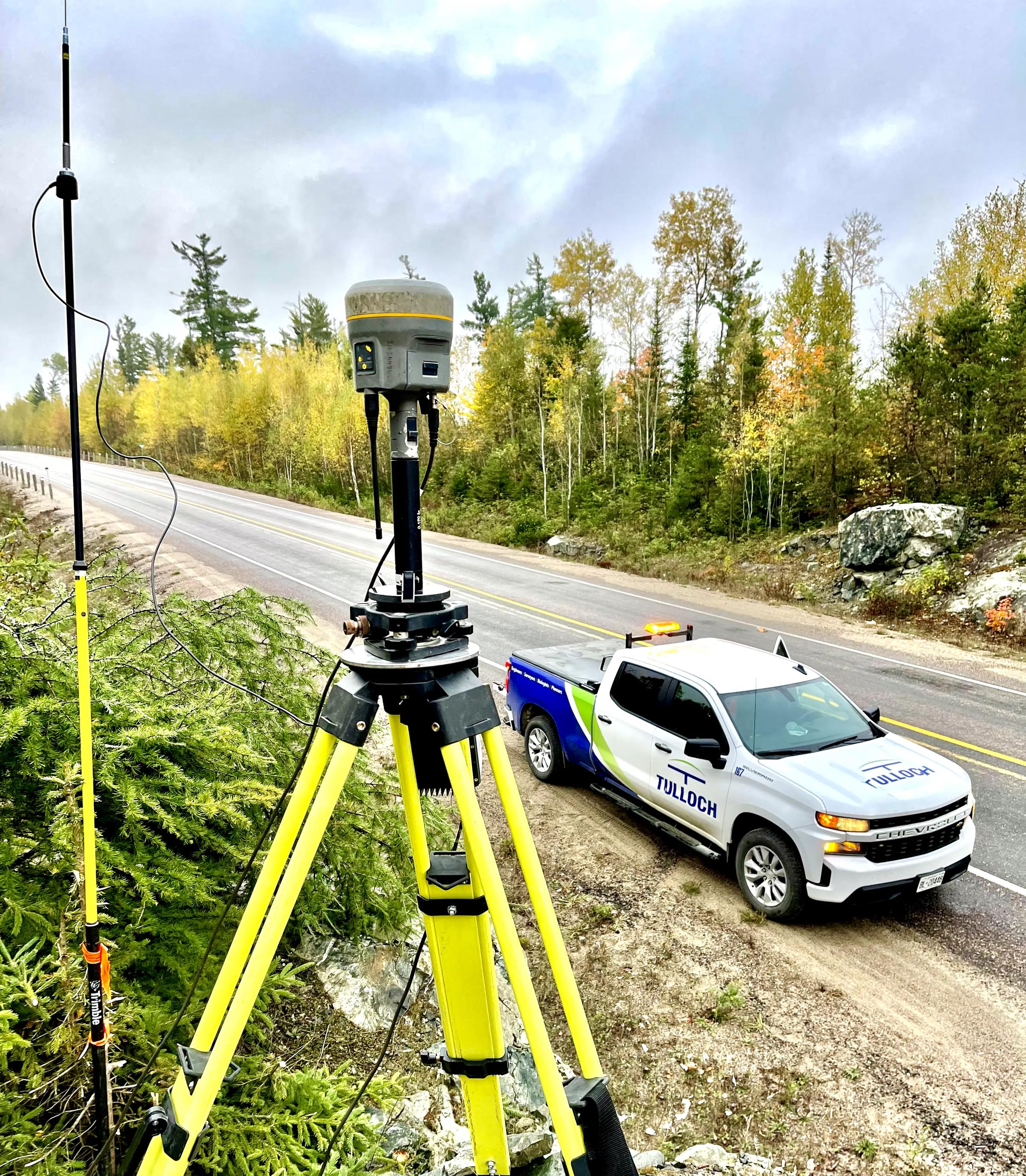 Survey equipment beside Highway 3 with a TULLOCH vehicle nearby.