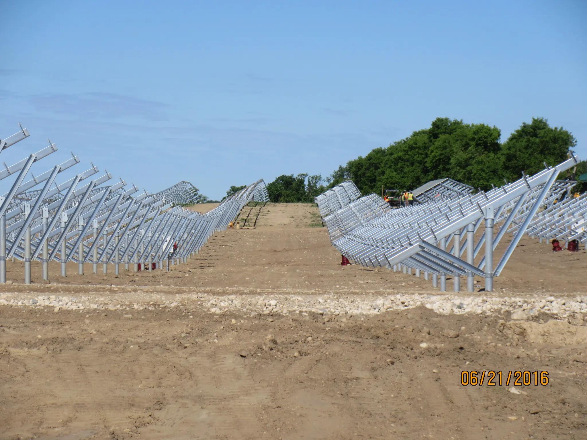 Solar racking foundations under construction at a utility-scale solar site.