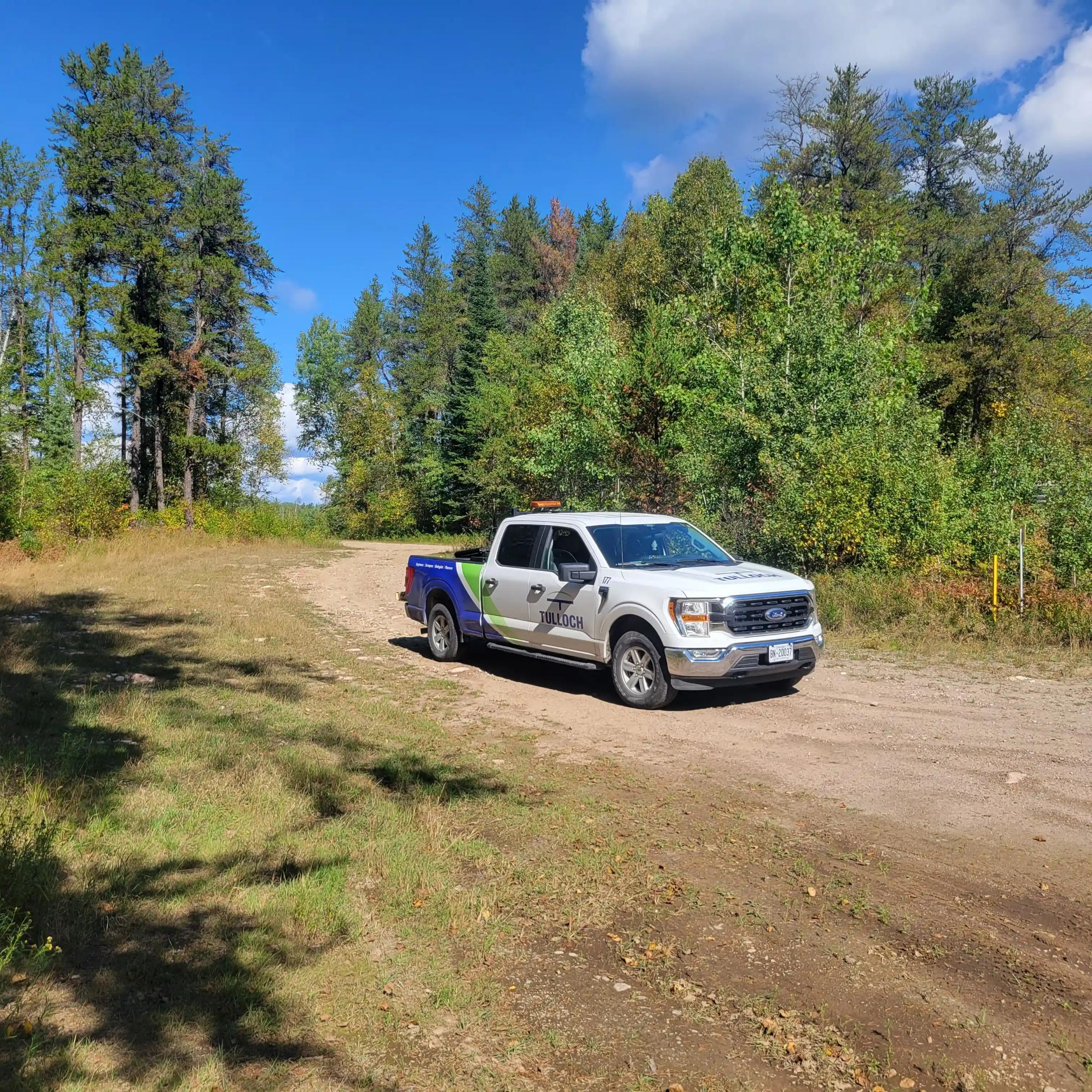 TULLOCH company truck travelling on a rural project road.