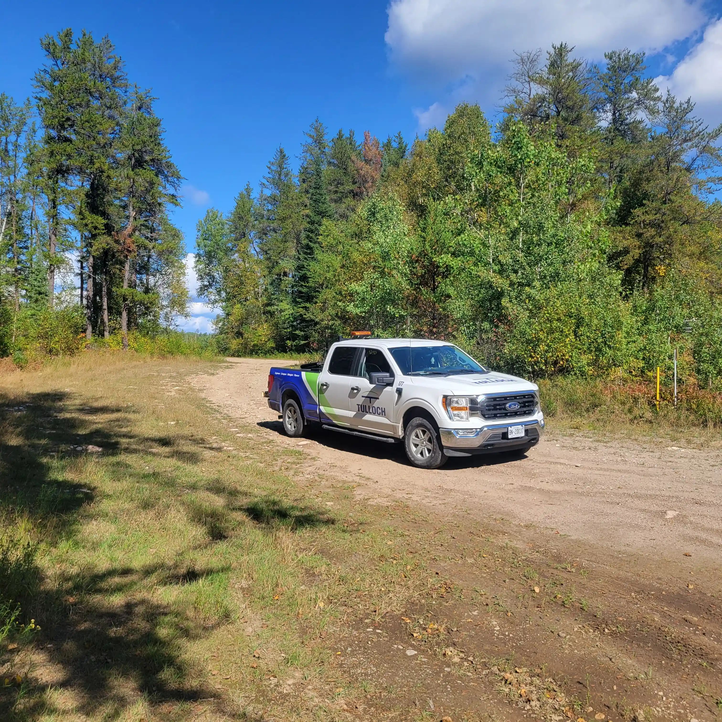 TULLOCH company truck travelling on a rural project road.
