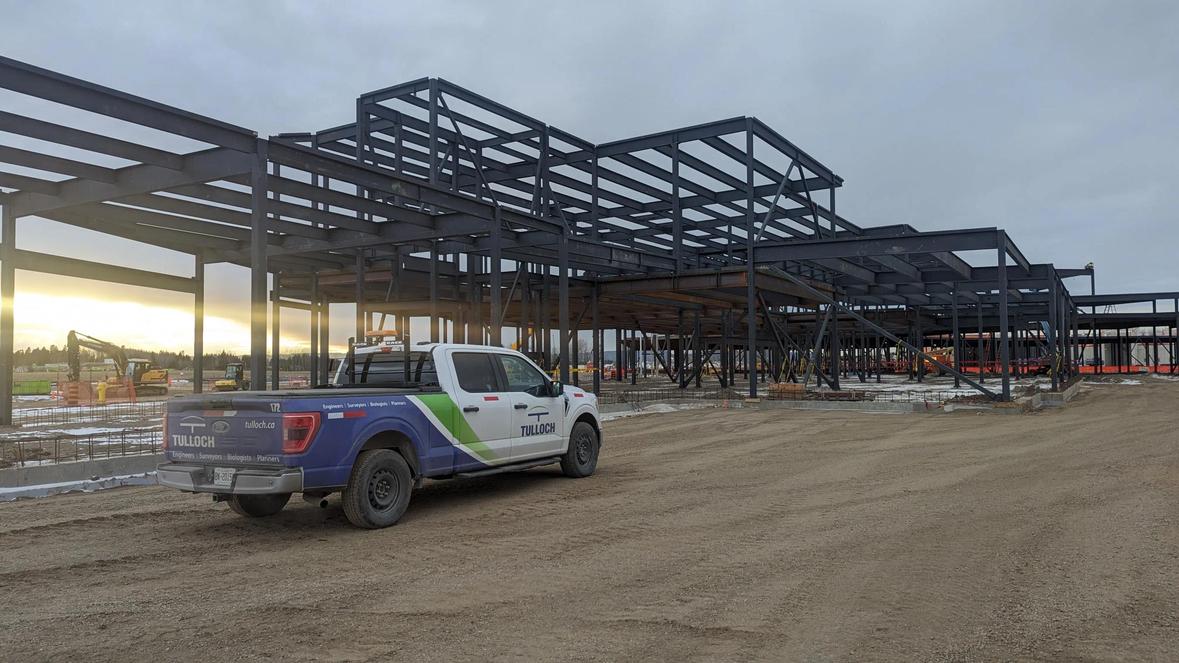 TULLOCH company truck at an active building construction site.