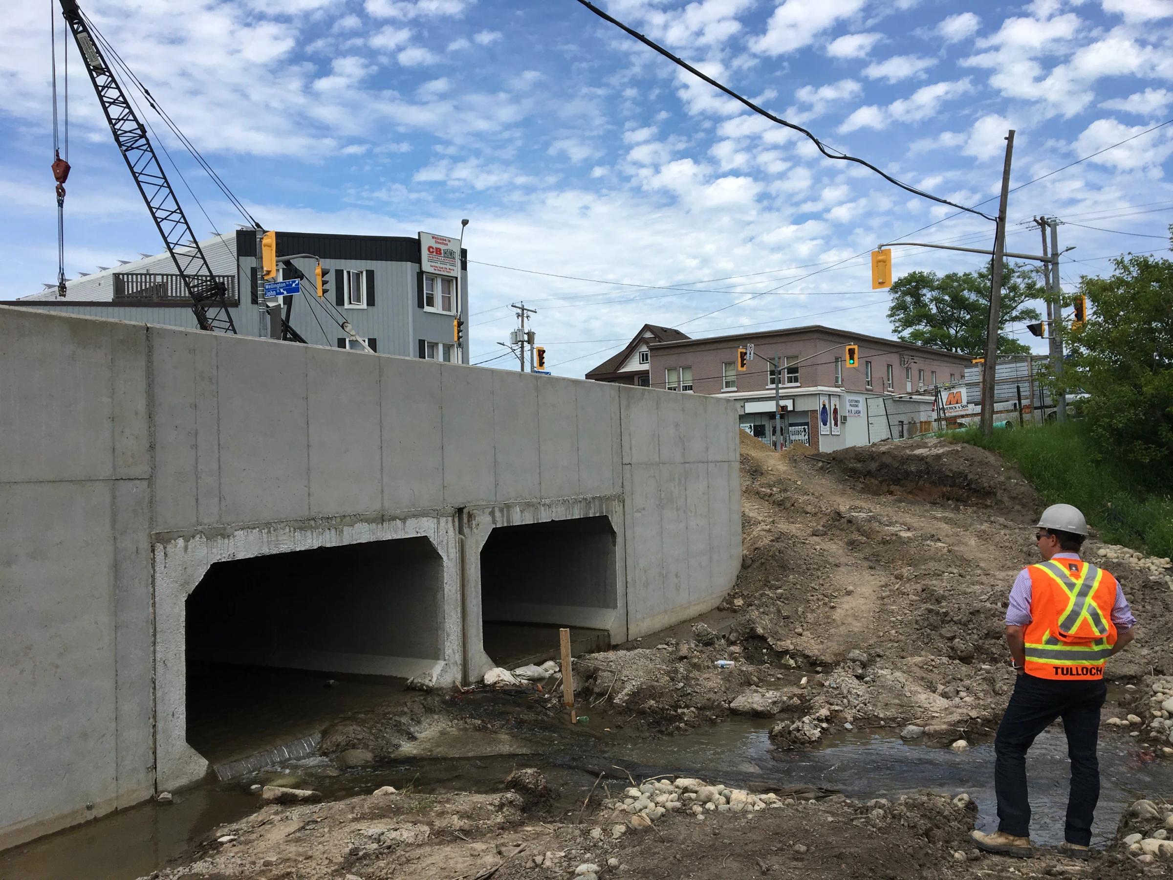 TULLOCH field technician reviewing culvert or crossing construction at Fort Creek.
