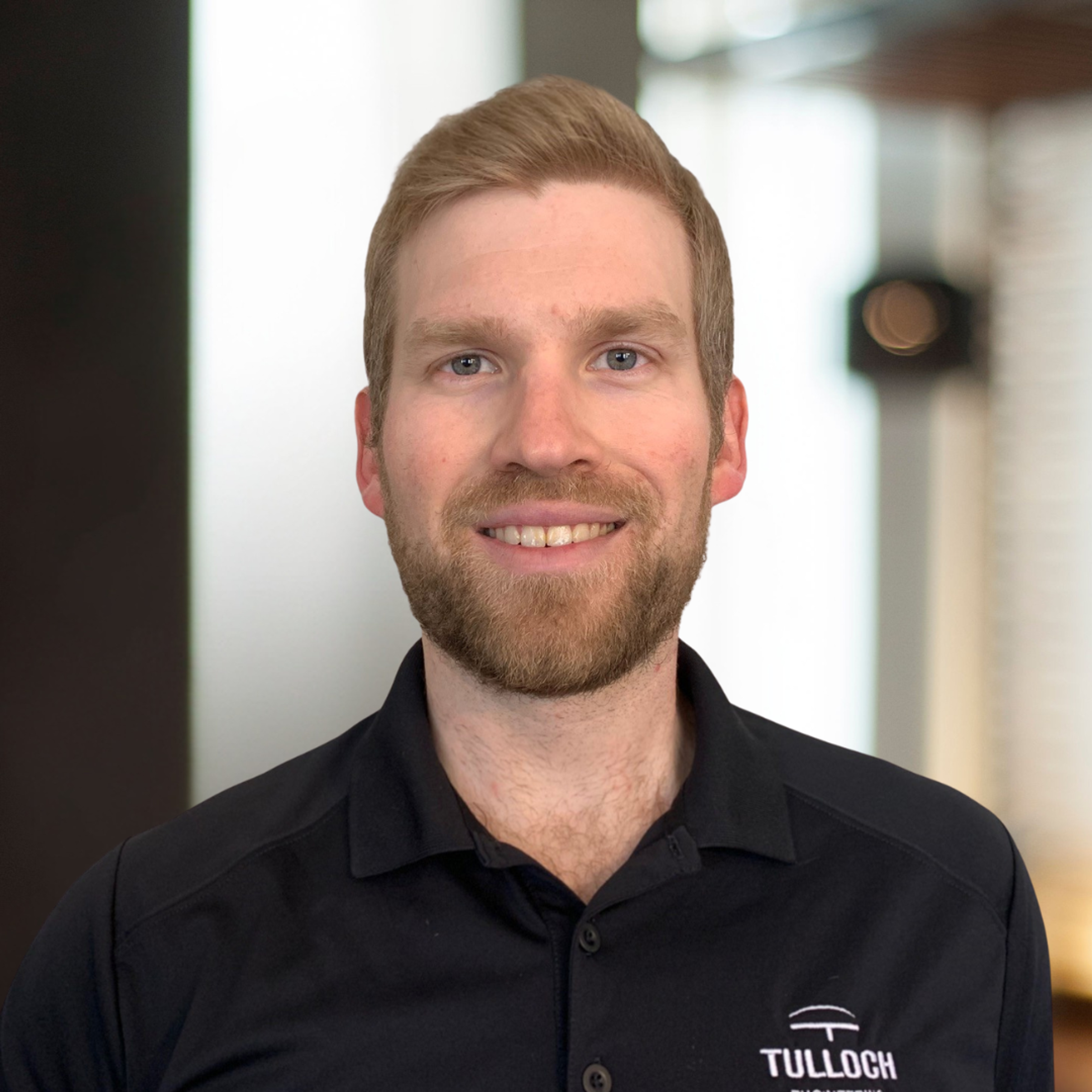 Headshot of Erik Giles, a TULLOCH engineering leader.