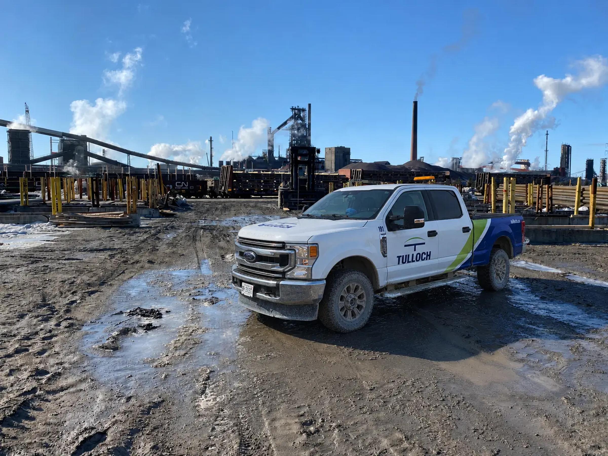 TULLOCH field truck at an active industrial site.
