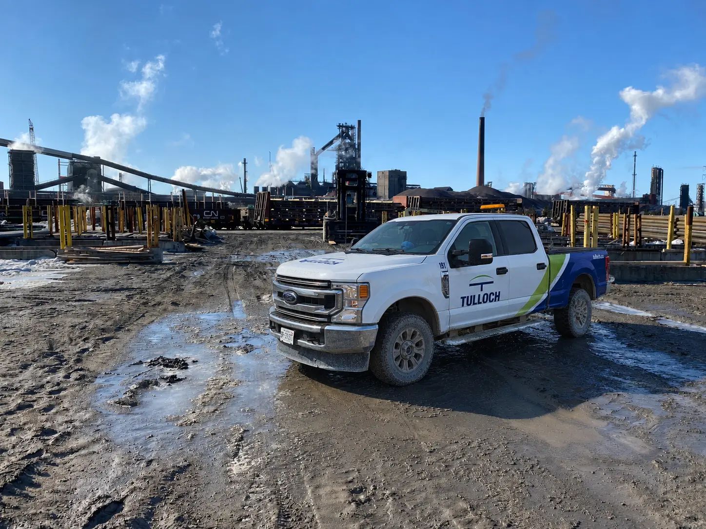 TULLOCH field truck at an active industrial site.