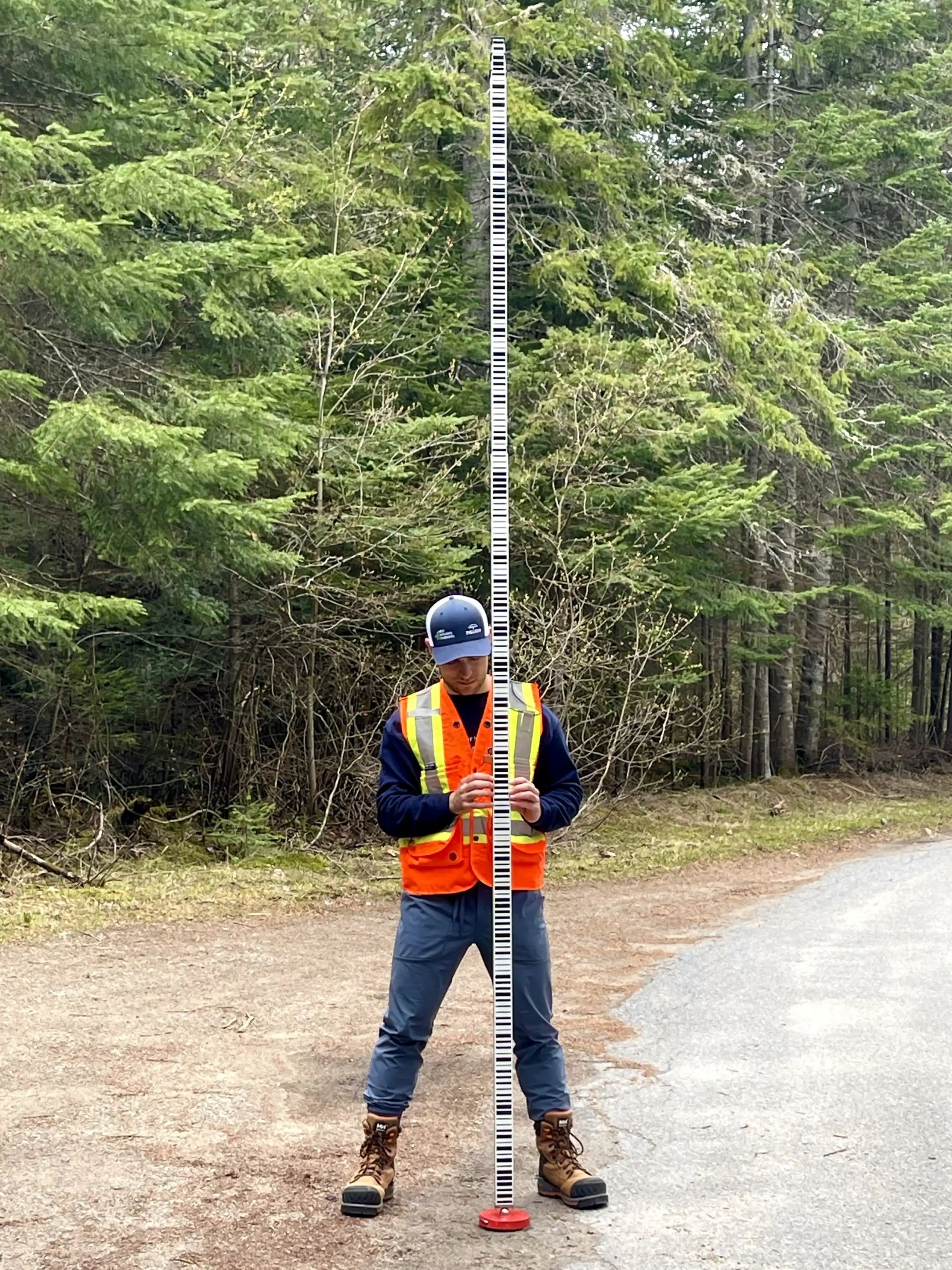 TULLOCH field technician completing survey work during the James Street reconstruction.