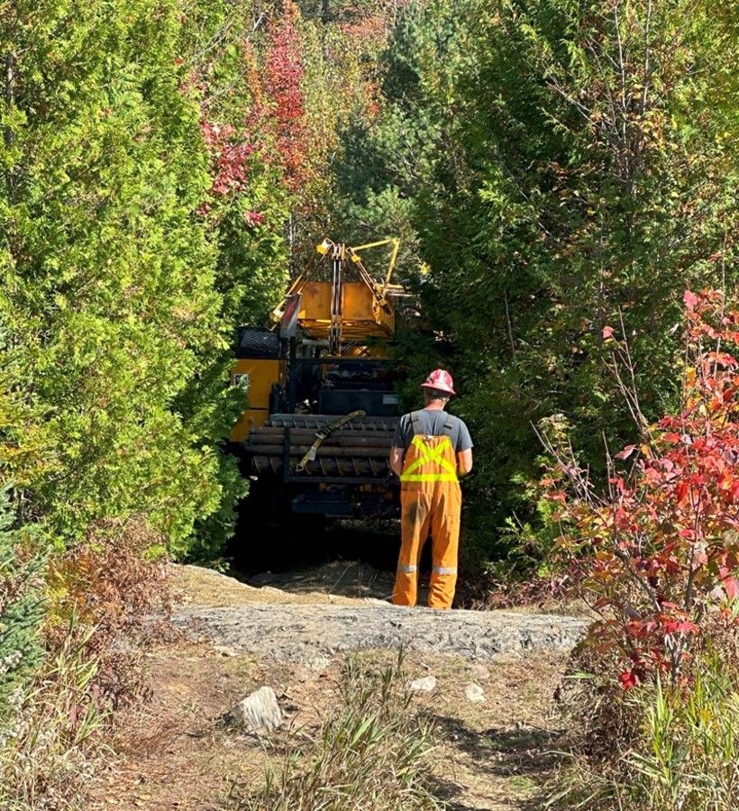 Field access along the Northeast Powerline corridor in forested terrain.