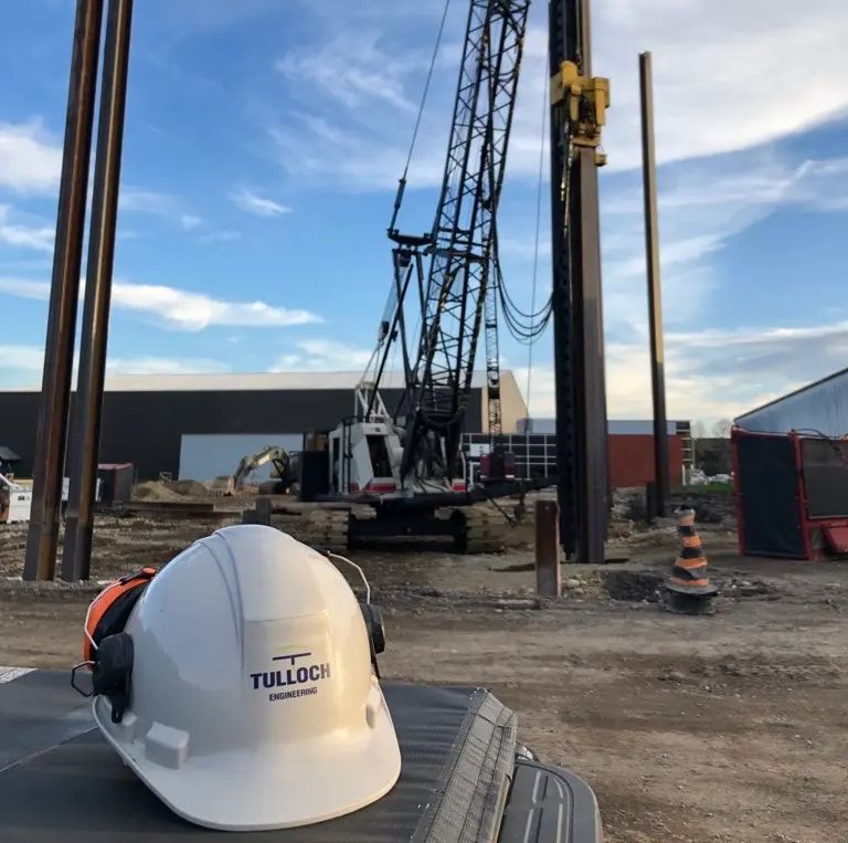 Geotechnical drilling equipment operating at an active project site.