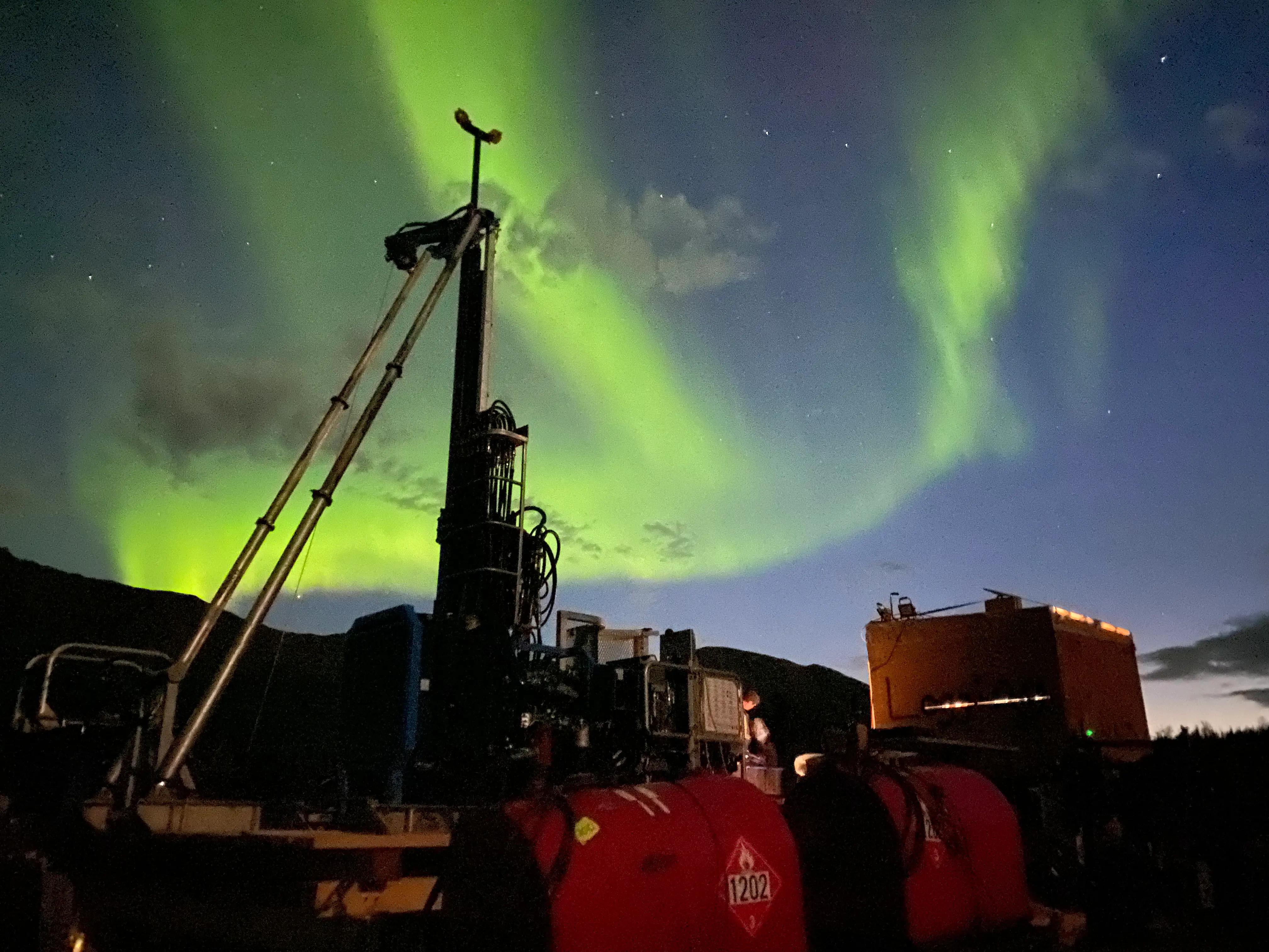 Drilling equipment operating under northern lights at the remote Goose Gold Mine in Nunavut.