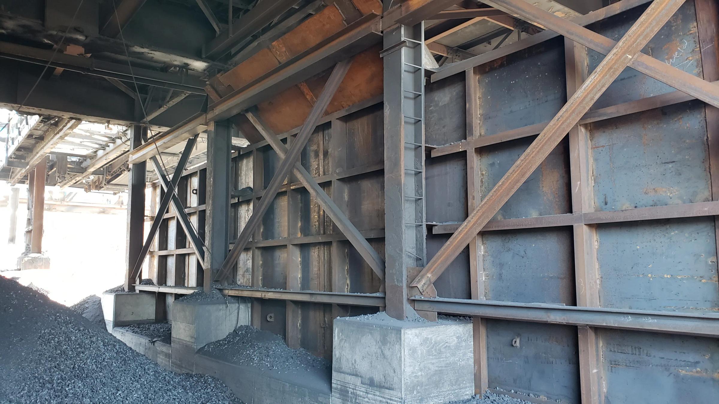 Structural steel framing and wall reinforcement during industrial rehabilitation.