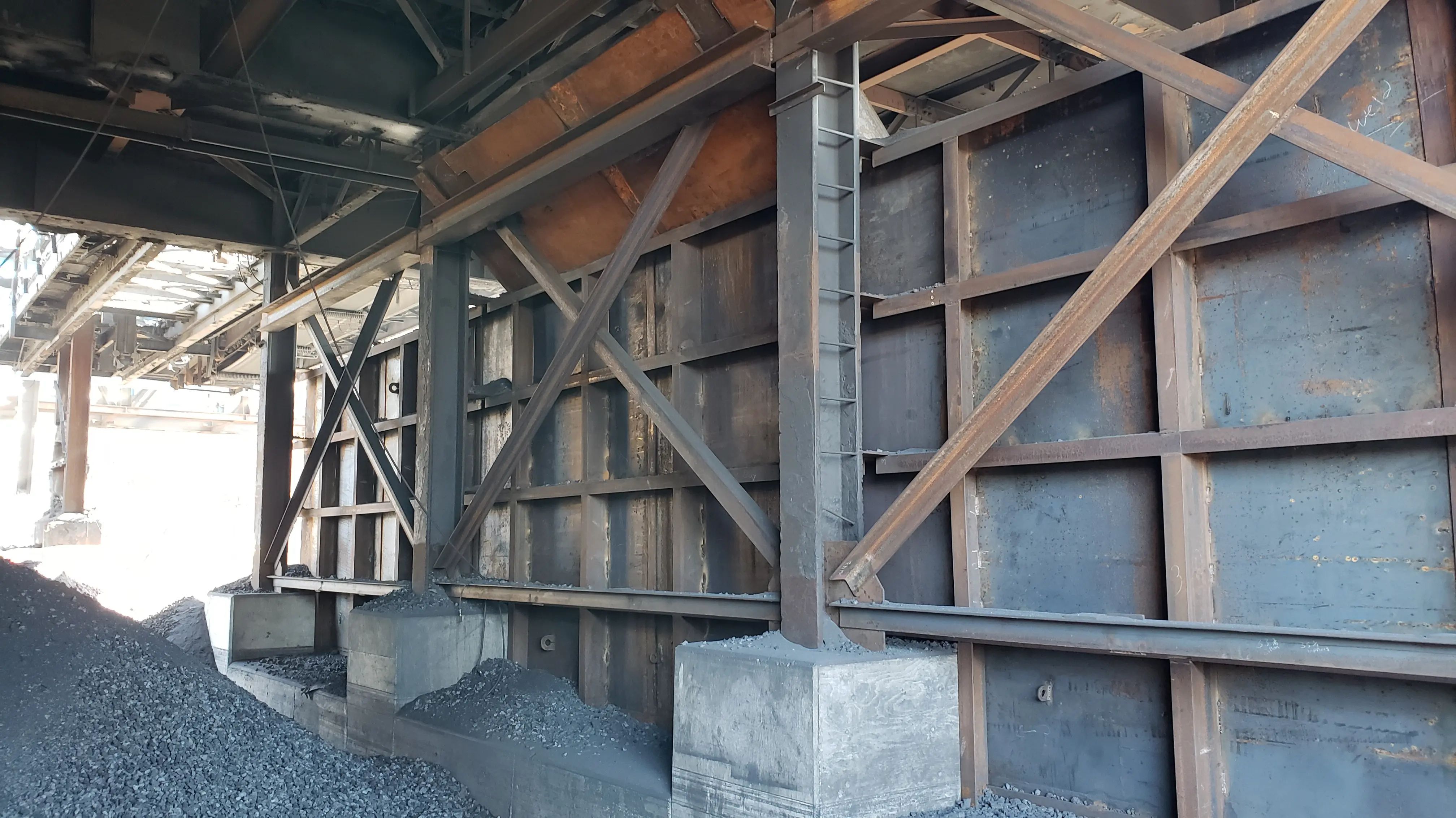 Structural steel framing and wall reinforcement during industrial rehabilitation.