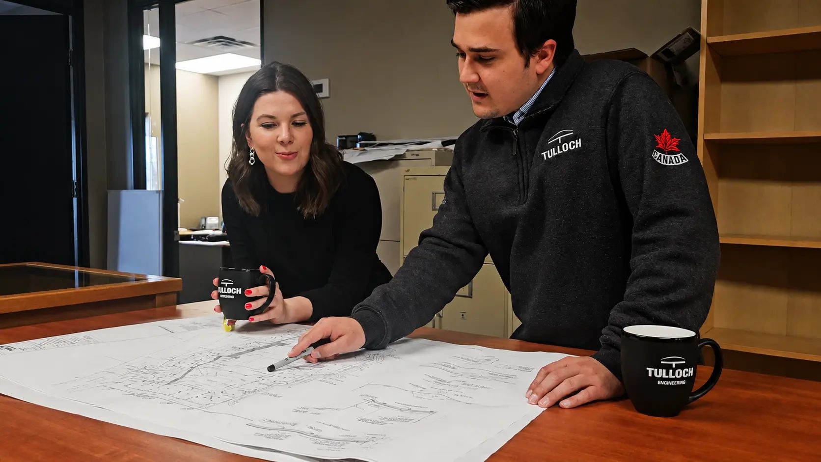 Sudbury Planning team reviewing drawings.