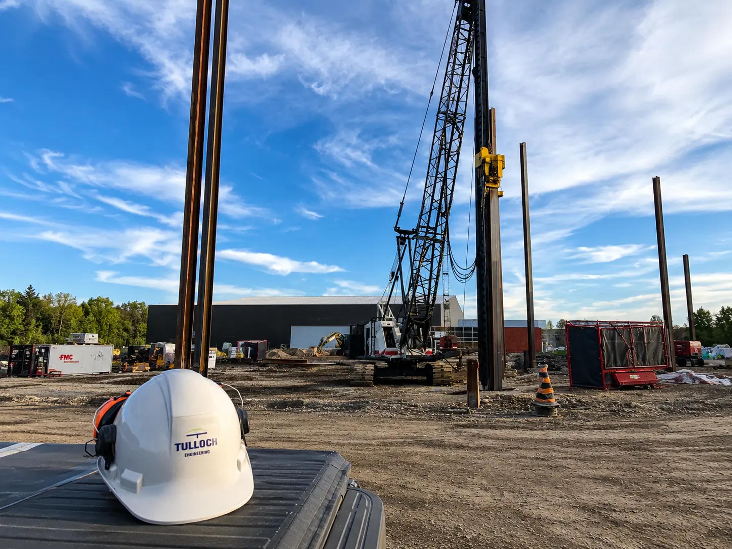 Geotechnical drilling equipment operating at an community project site.