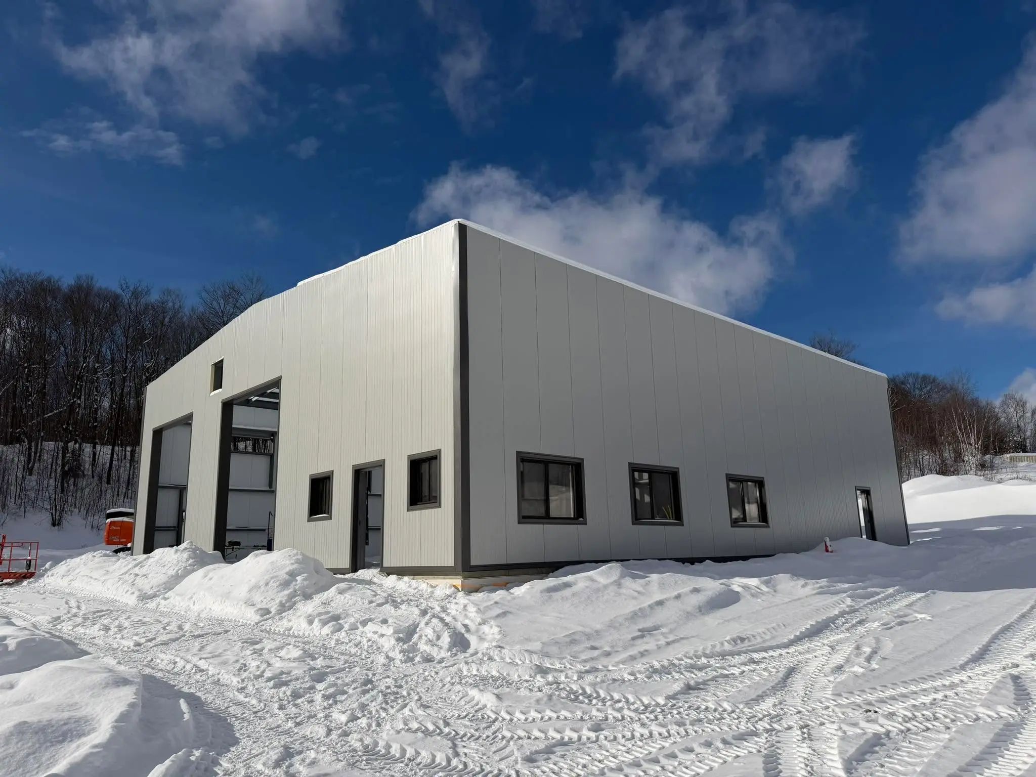 Exterior of a newly constructed industrial or municipal building in winter.