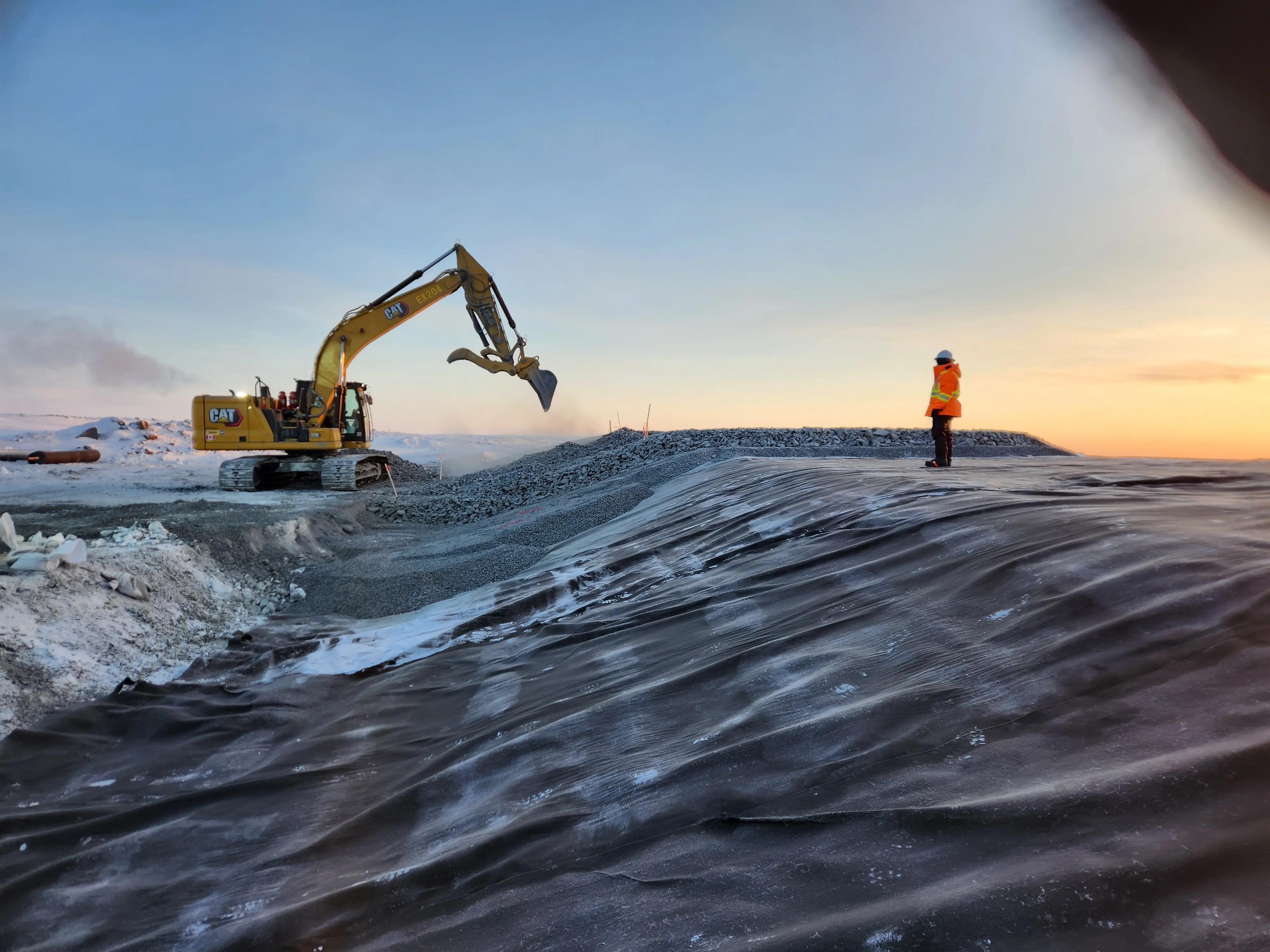 Earthworks and quality assurance activities during dam construction at Goose Gold Mine in Nunavut.