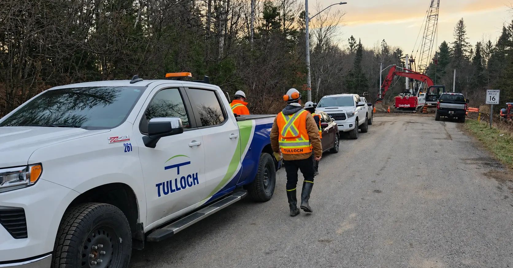 TULLOCH field staff and company vehicles at an active municipal construction project.