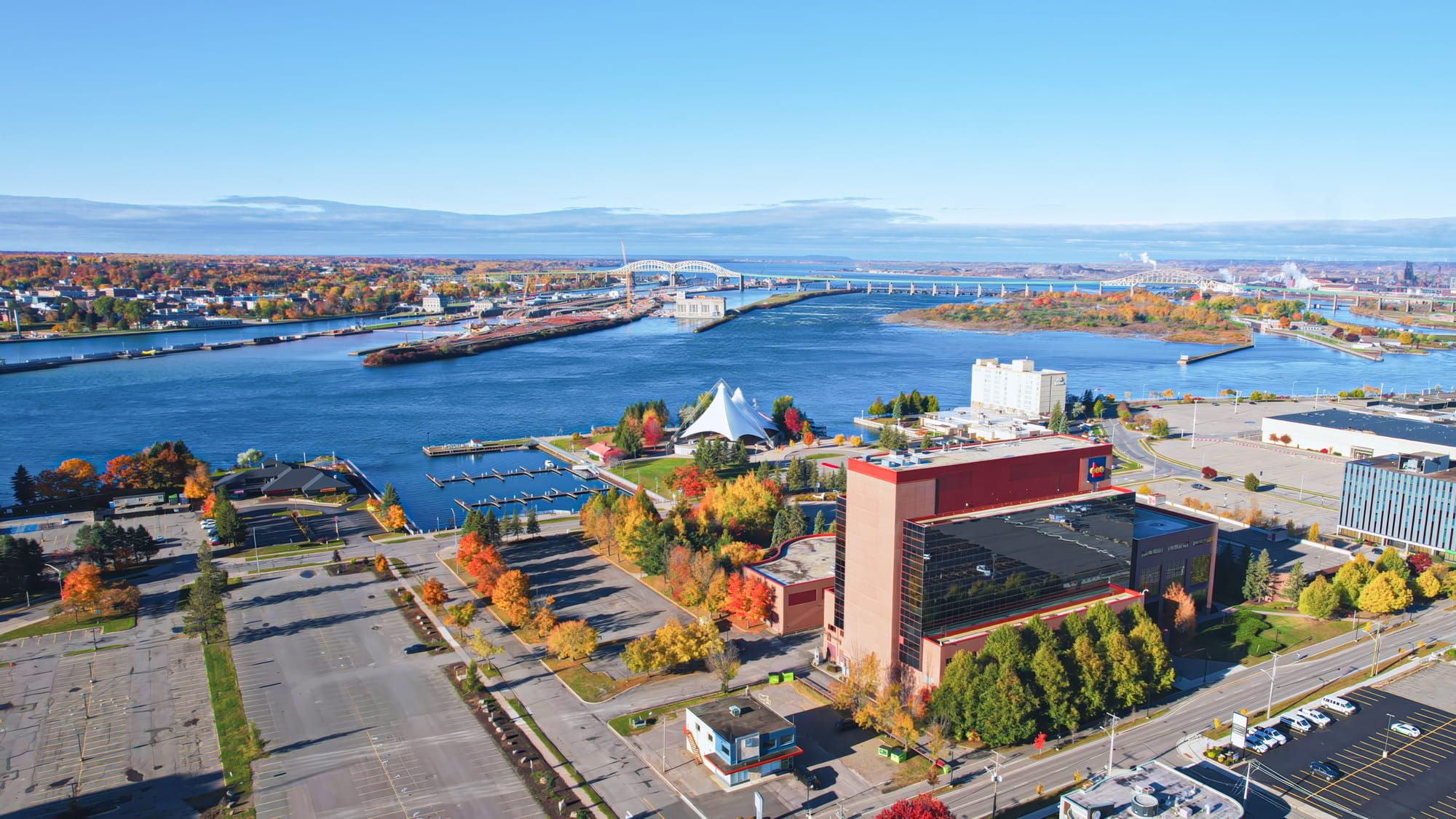 Aerial view of an industrial facility beside a large waterbody.