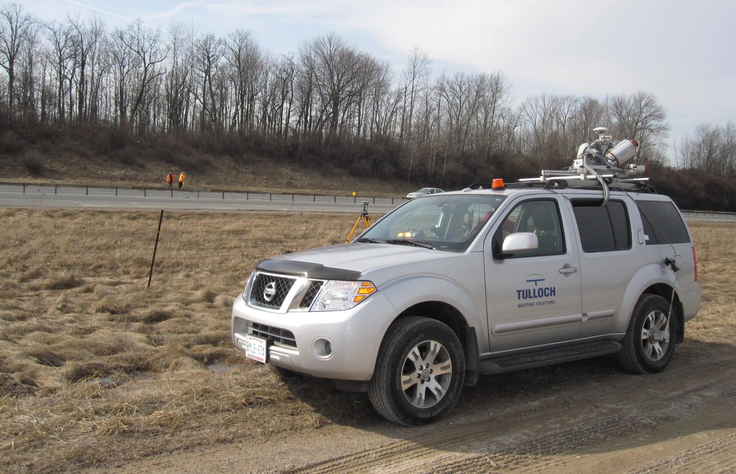 TULLOCH mobile LiDAR vehicle positioned beside Highway 400 for corridor data collection.