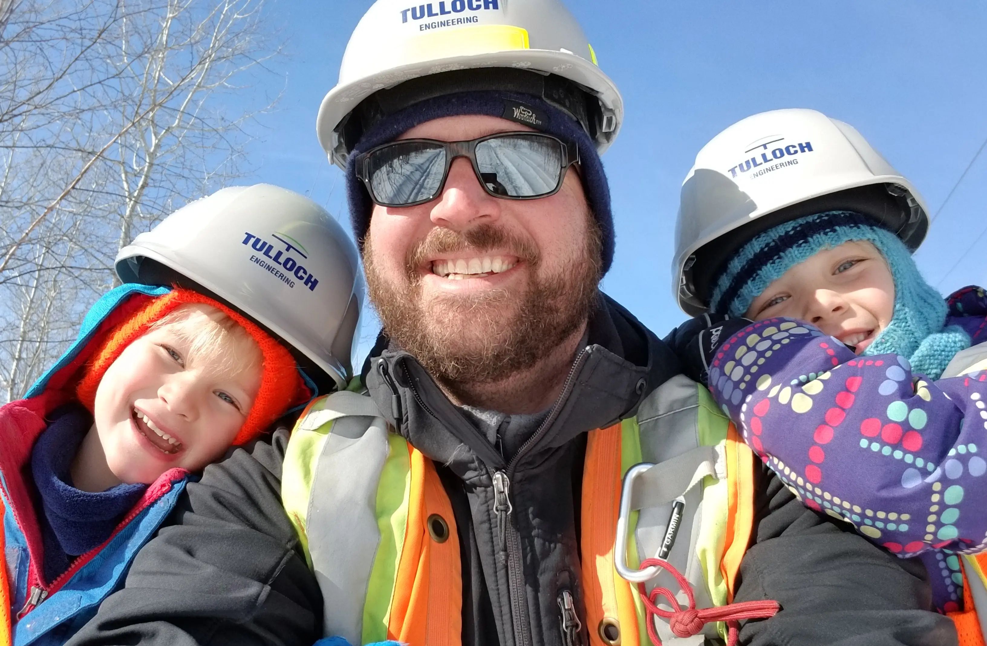 Staff member and kids enjoying a winter day.