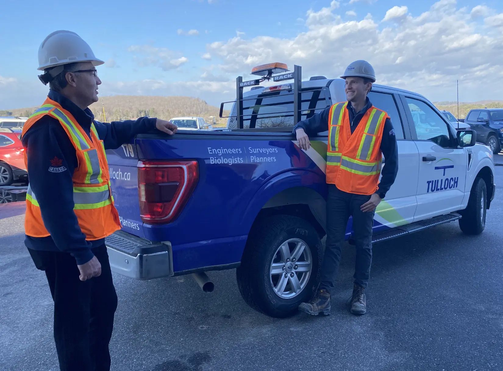 Chatting by the TULLOCH truck.
