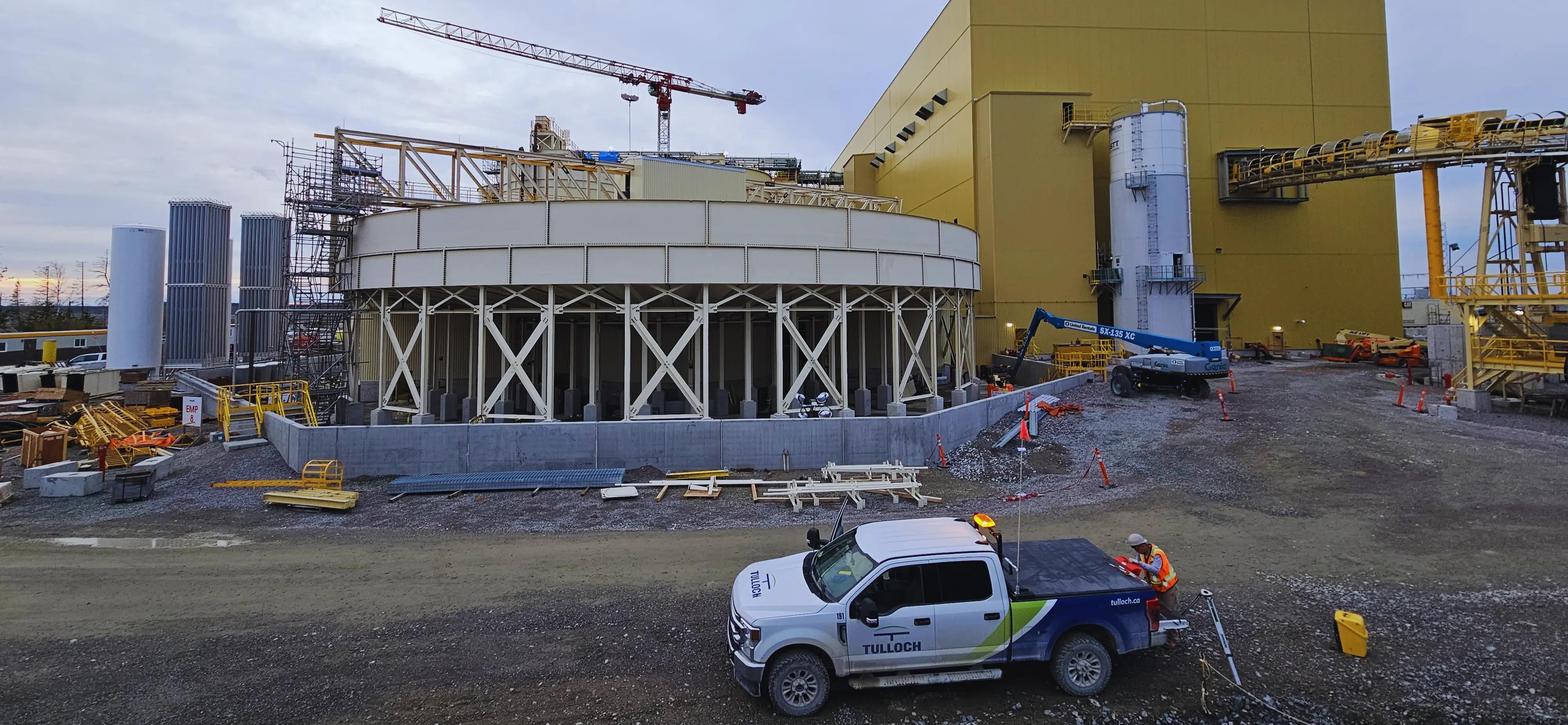 Active mine building construction site with a TULLOCH field vehicle.